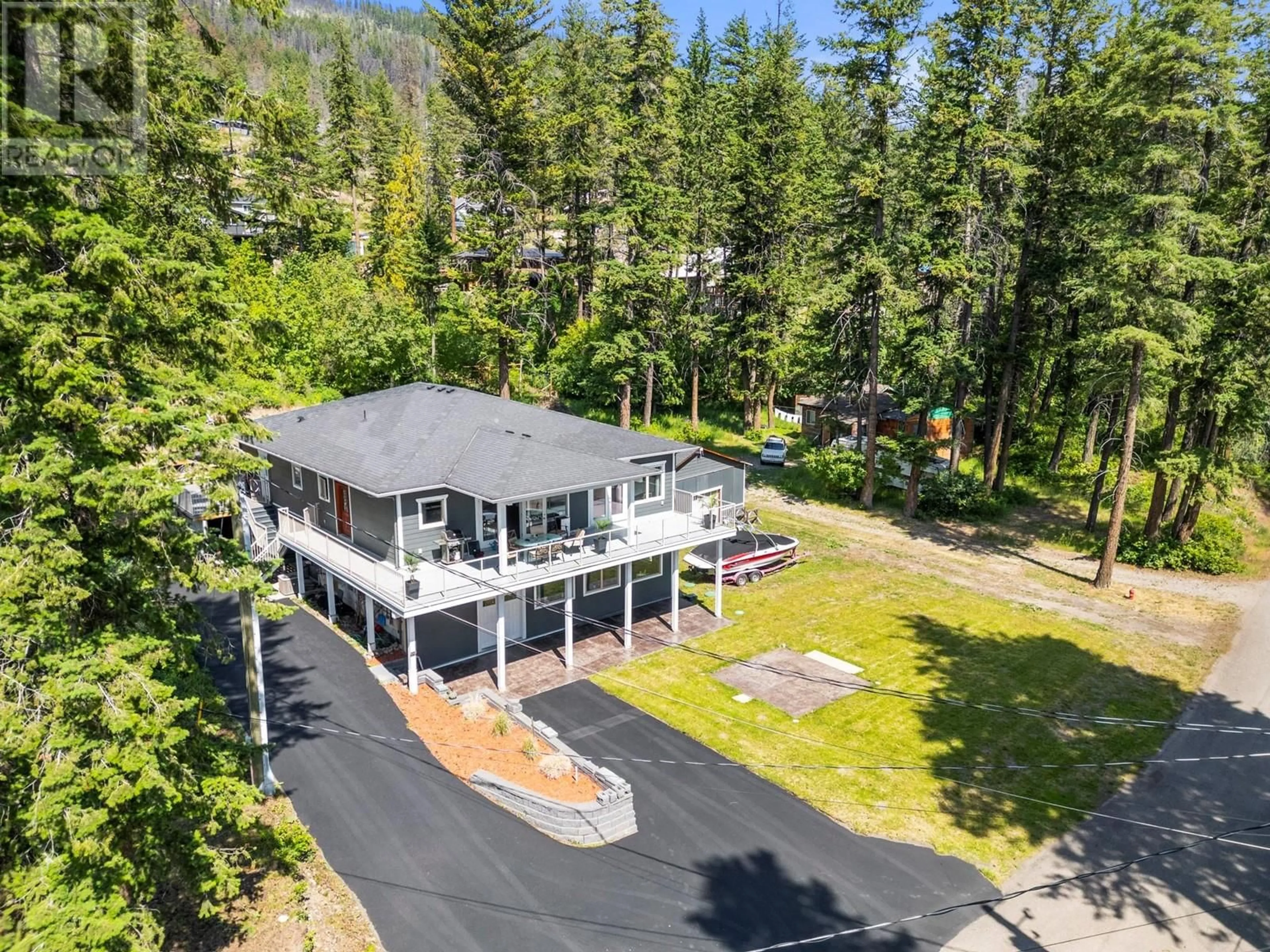 A pic from outside/outdoor area/front of a property/back of a property/a pic from drone, mountain view for 70 LESTER ROAD, Vernon British Columbia V1H2G3