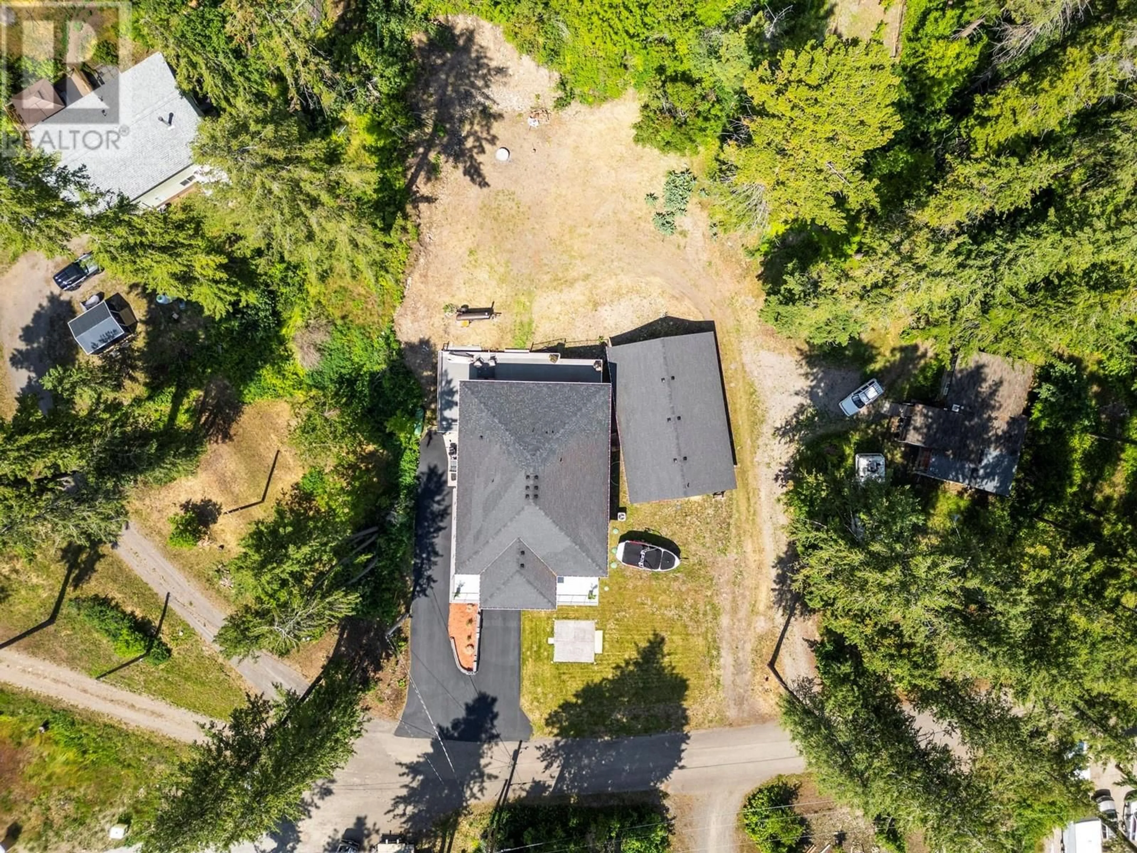 A pic from outside/outdoor area/front of a property/back of a property/a pic from drone, forest/trees view for 70 LESTER ROAD, Vernon British Columbia V1H2G3