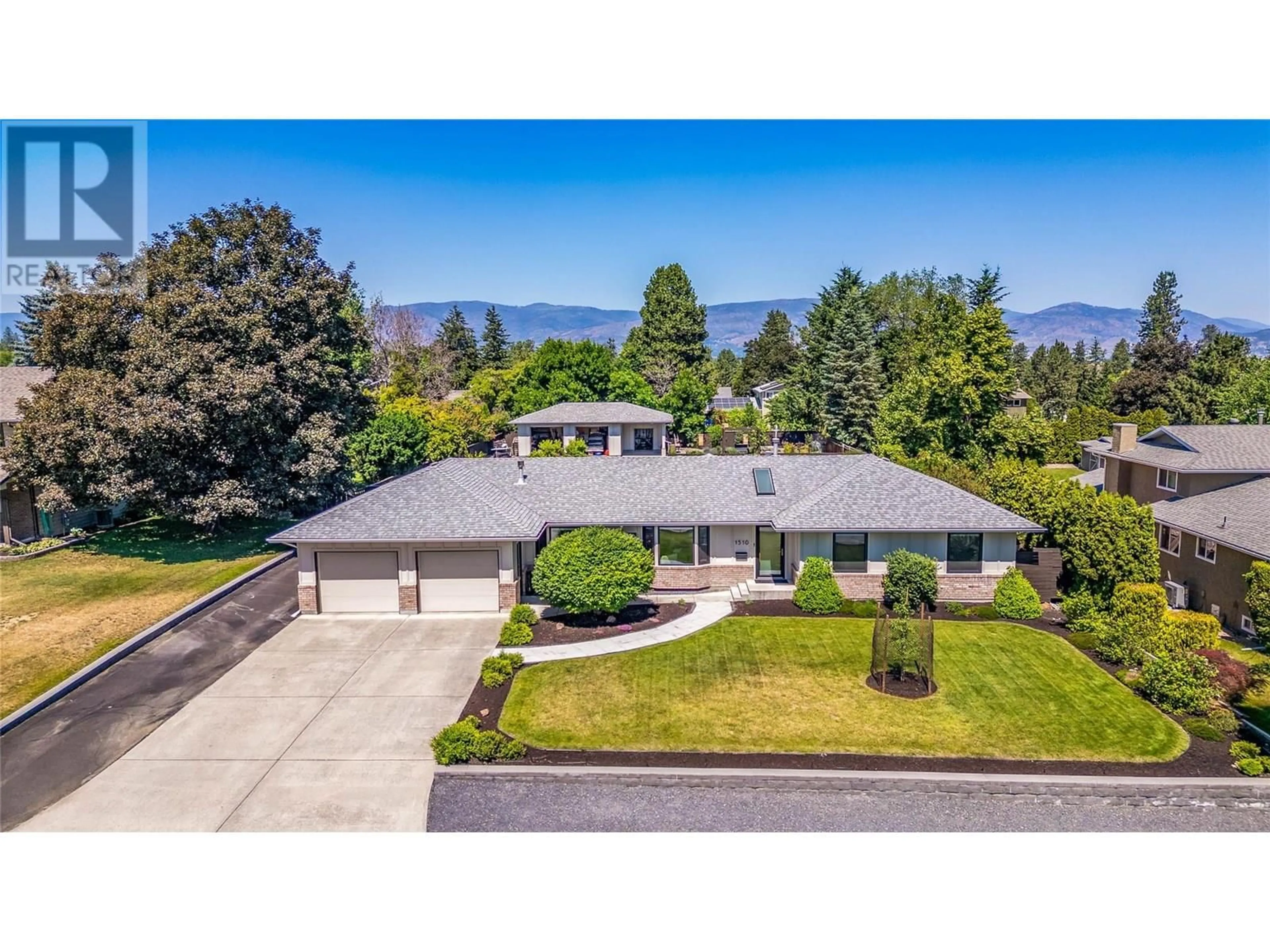 A pic from outside/outdoor area/front of a property/back of a property/a pic from drone, mountain view for 1510 APPLERIDGE ROAD, Kelowna British Columbia V1W3A5