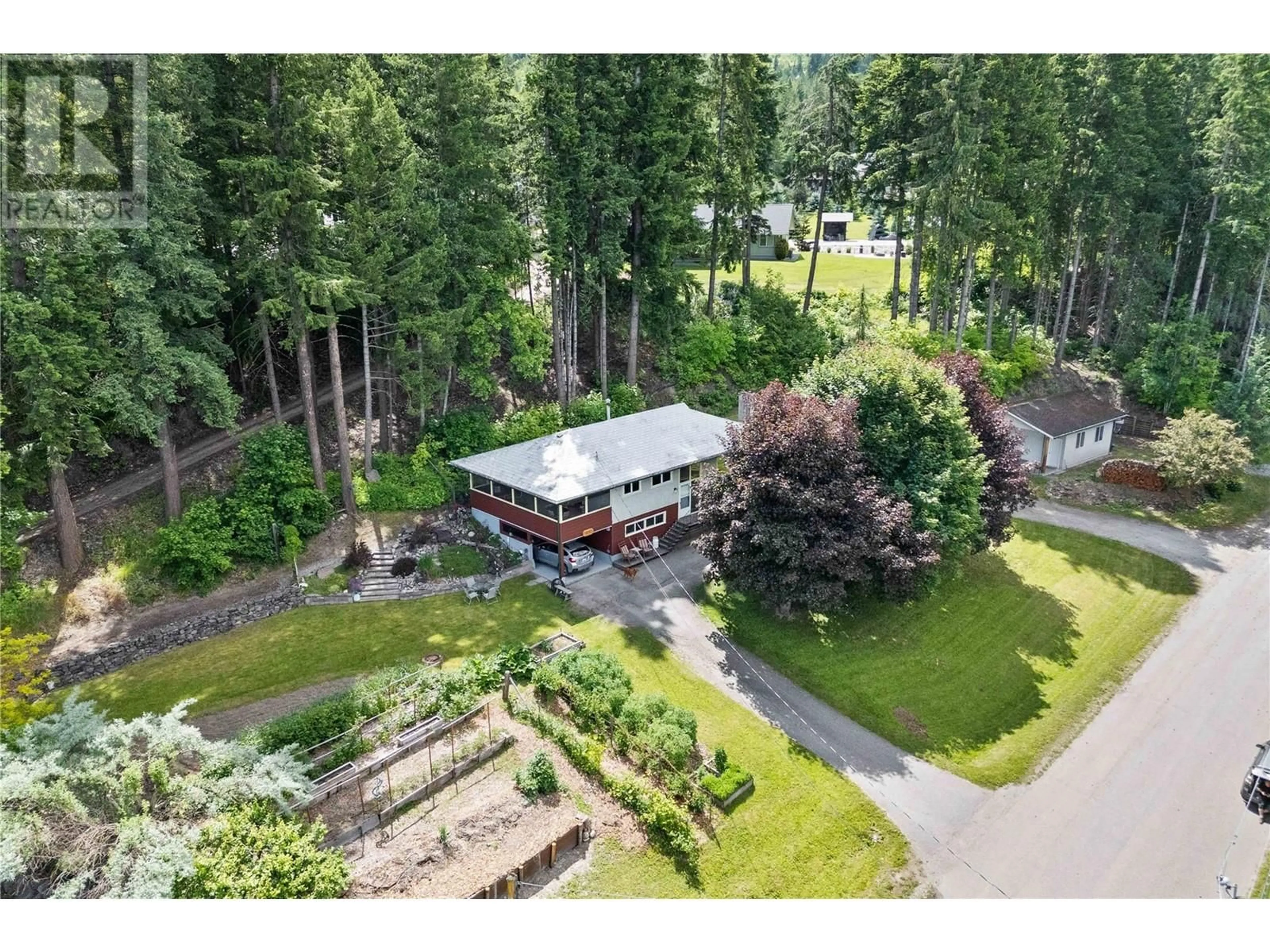 A pic from outside/outdoor area/front of a property/back of a property/a pic from drone, forest/trees view for 1230 1 STREET SOUTHEAST, Salmon Arm British Columbia V1E1J3