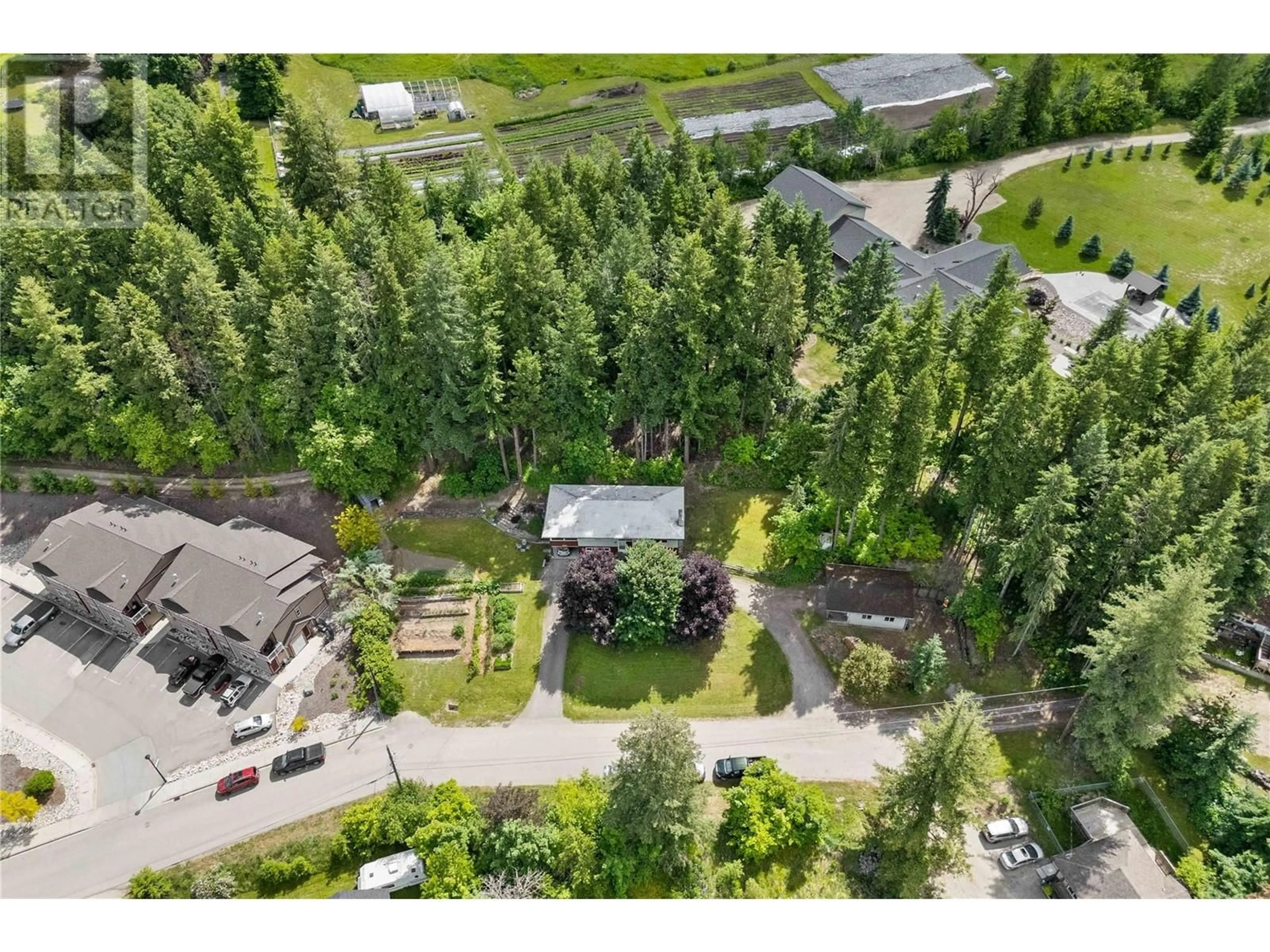 A pic from outside/outdoor area/front of a property/back of a property/a pic from drone, forest/trees view for 1230 1 STREET SOUTHEAST, Salmon Arm British Columbia V1E1J3