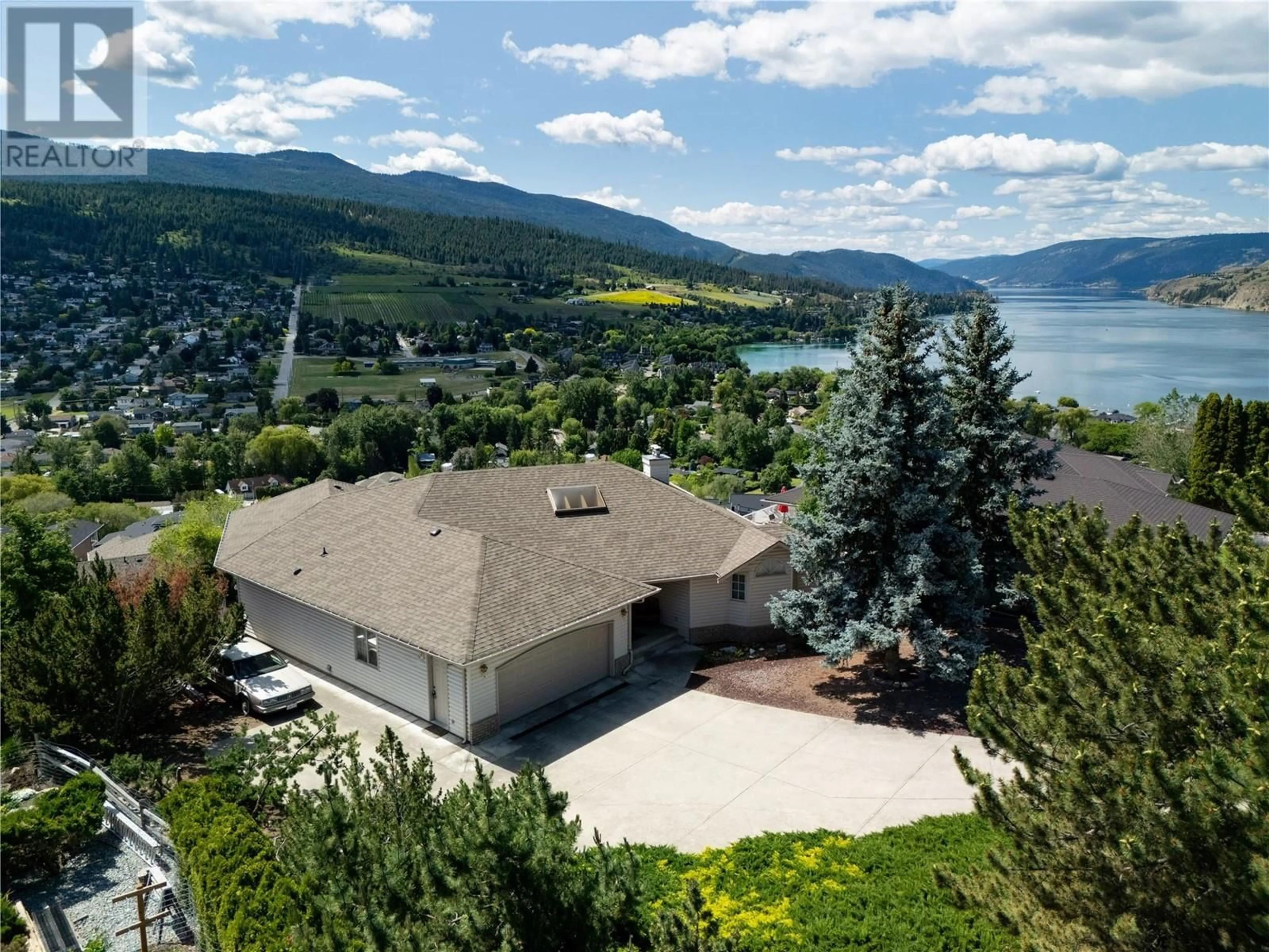 A pic from outside/outdoor area/front of a property/back of a property/a pic from drone, water/lake/river/ocean view for 8827 MICHAELS DRIVE, Coldstream British Columbia V1B2P5