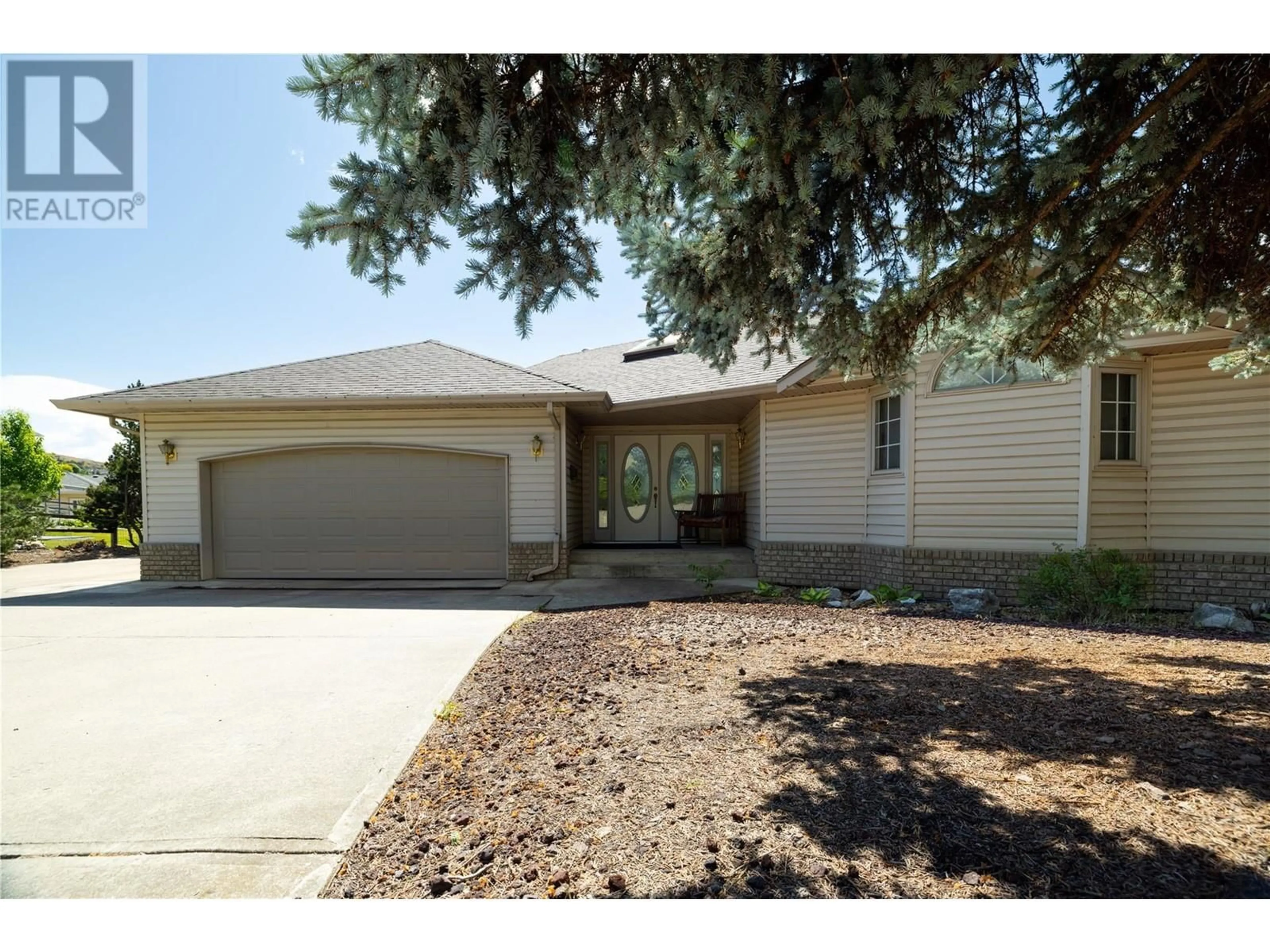 Home with vinyl exterior material, street for 8827 MICHAEL DRIVE, Coldstream British Columbia V1B2P5