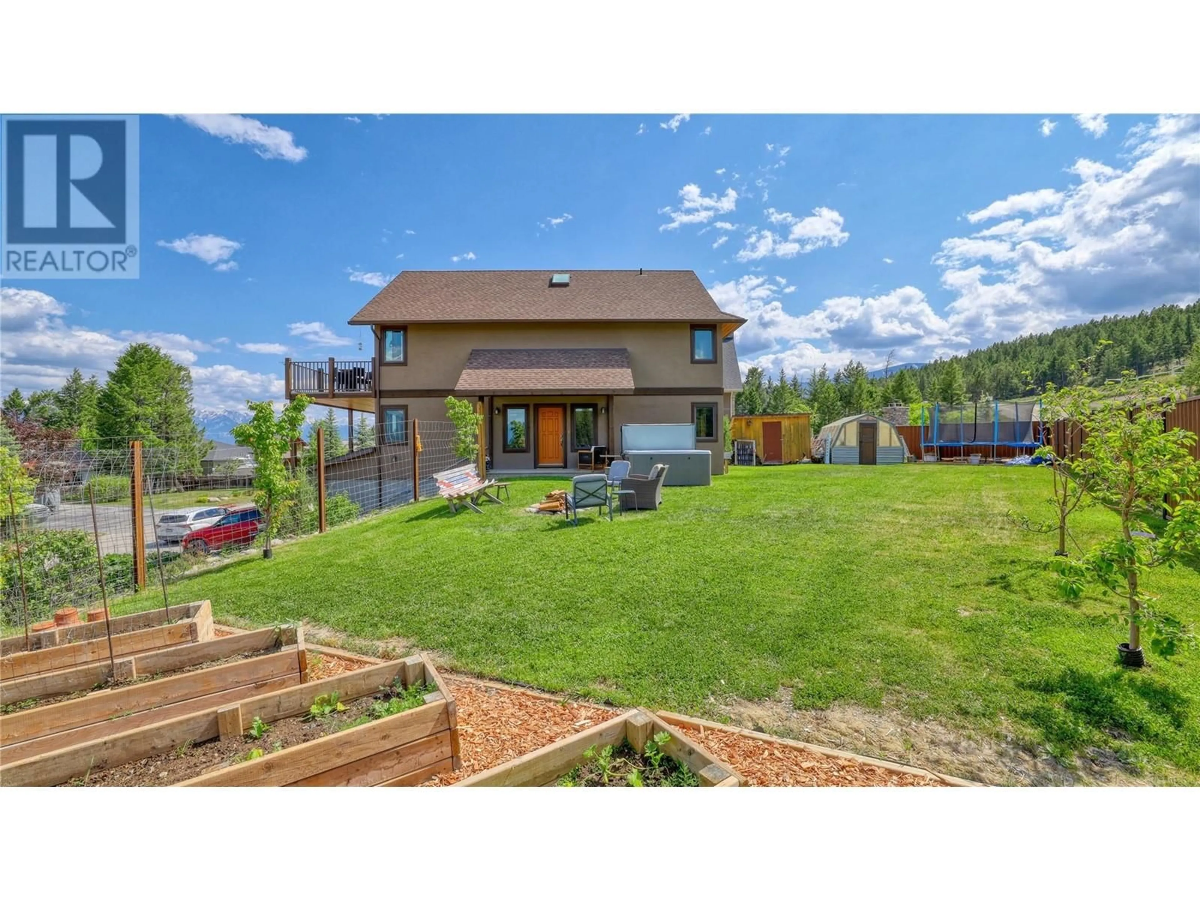 A pic from outside/outdoor area/front of a property/back of a property/a pic from drone, mountain view for 1910 PINERIDGE DRIVE, Invermere British Columbia V0A1K4