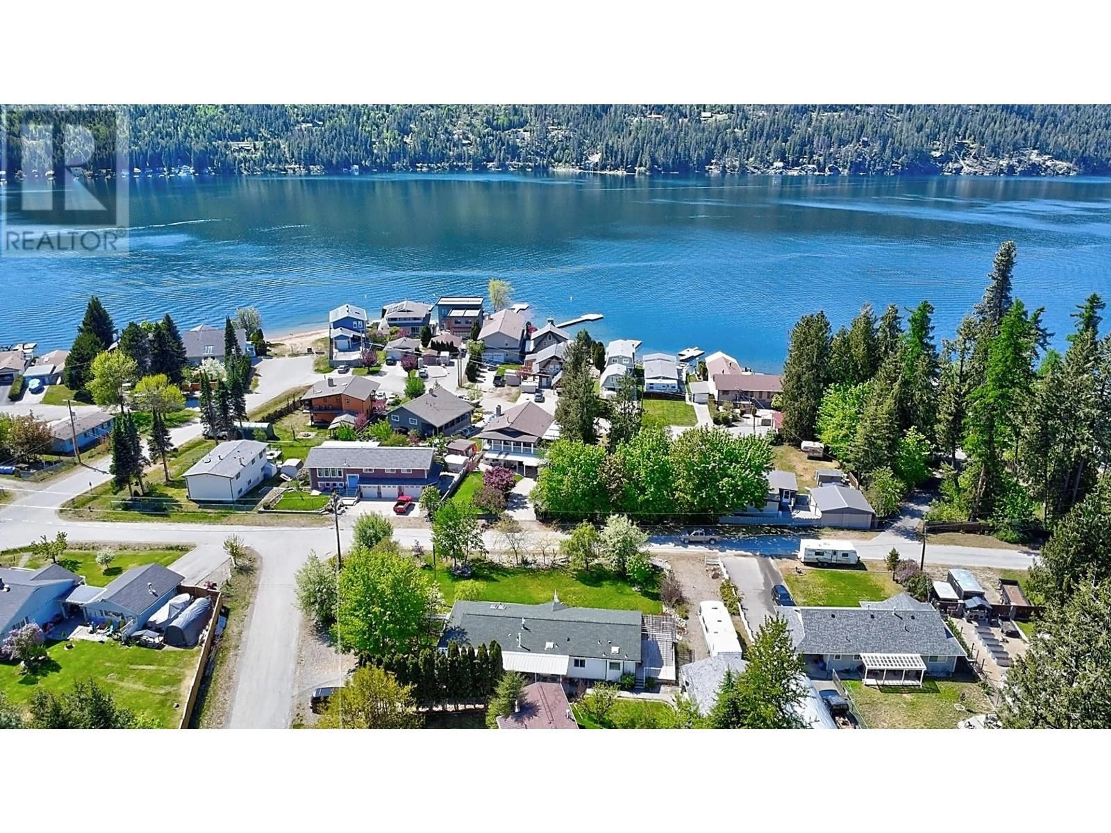 A pic from outside/outdoor area/front of a property/back of a property/a pic from drone, water/lake/river/ocean view for 82 FRANSON ROAD, Christina Lake British Columbia V0H1E2