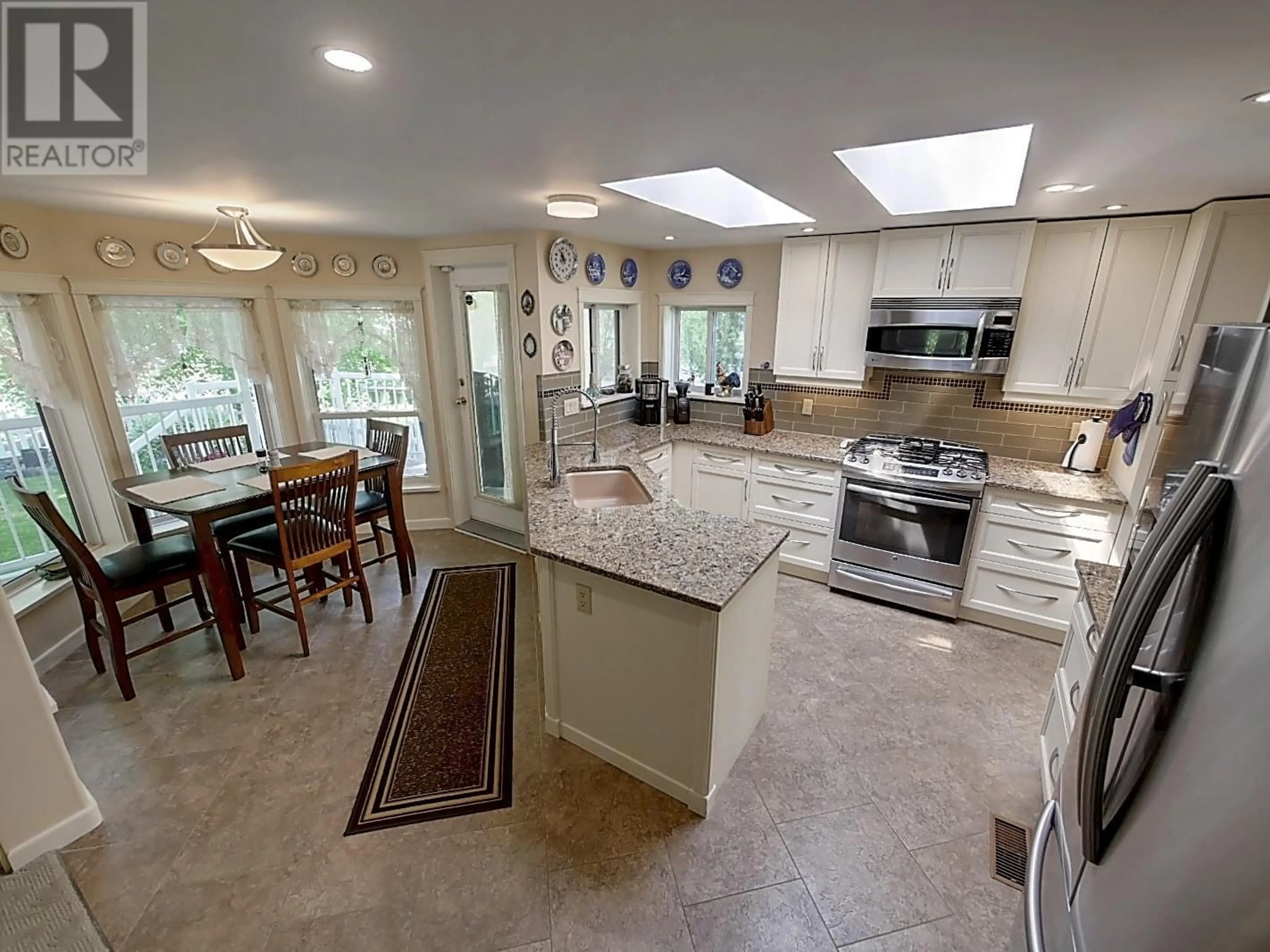 Open concept kitchen, ceramic/tile floor for 82 FRANSON ROAD, Christina Lake British Columbia V0H1E2