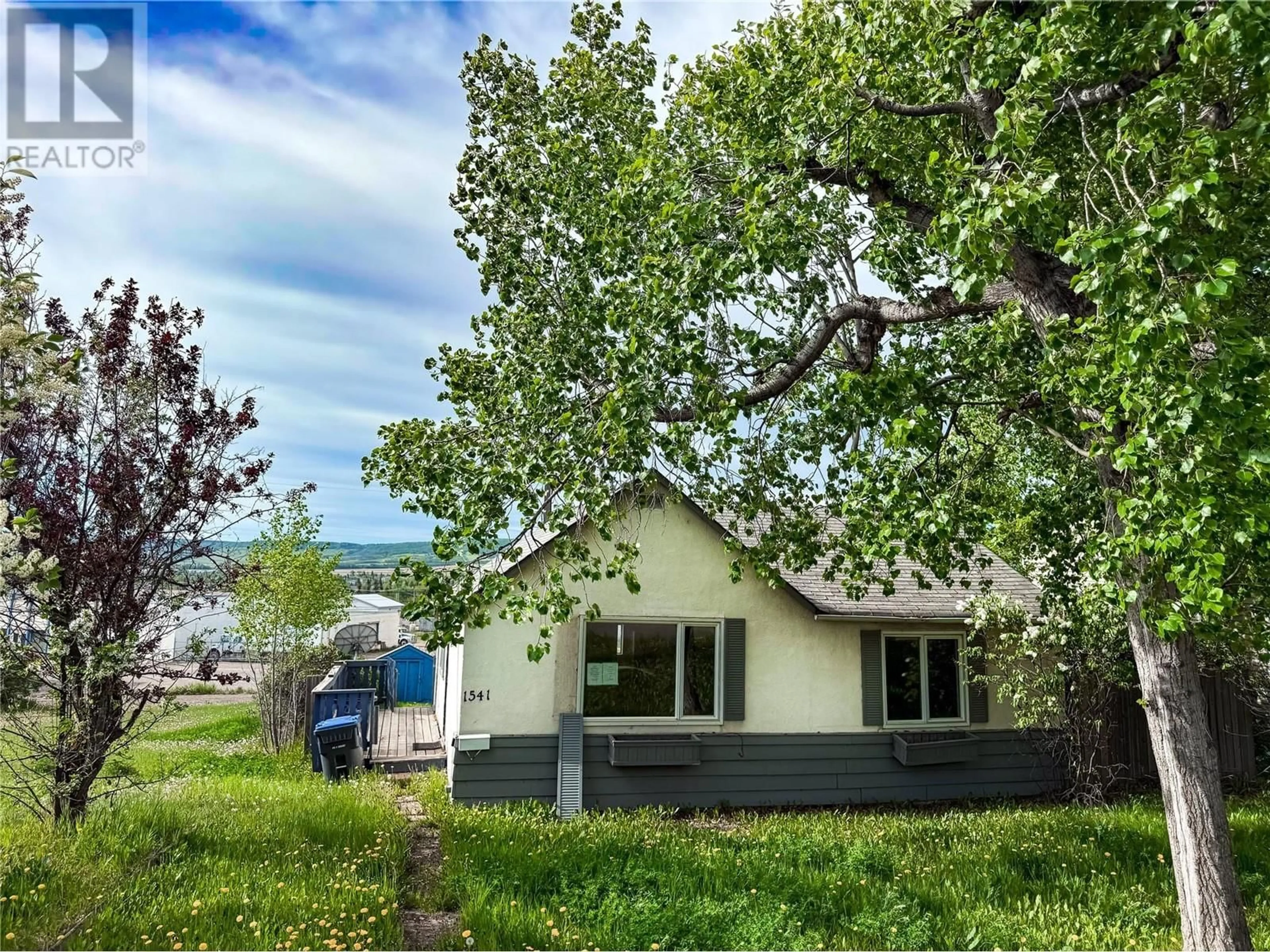 A pic from outside/outdoor area/front of a property/back of a property/a pic from drone, street for 1541 96 AVENUE, Dawson Creek British Columbia V1G1L2
