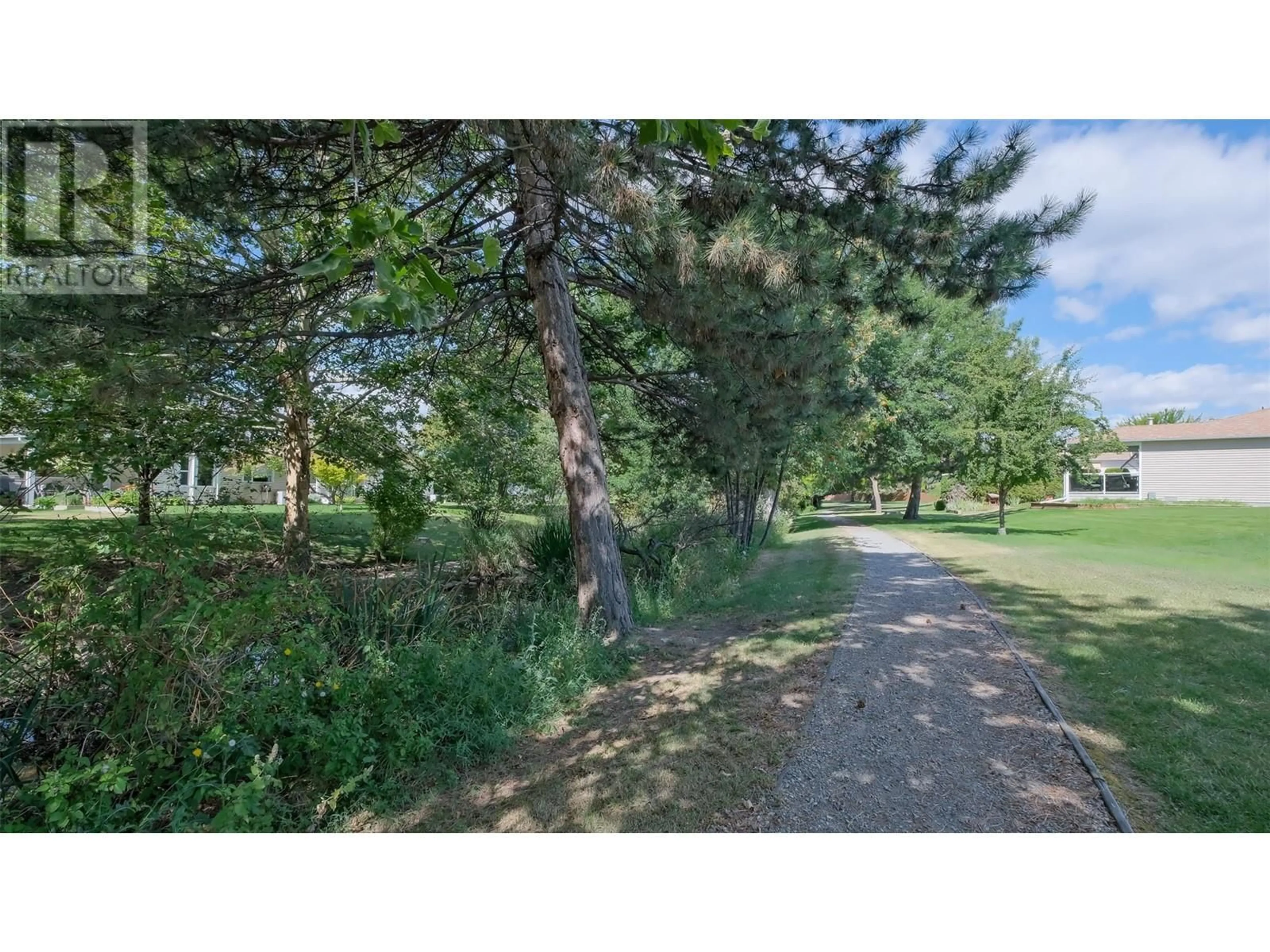 A pic from outside/outdoor area/front of a property/back of a property/a pic from drone, forest/trees view for 425 - 1260 RAYMER AVENUE, Kelowna British Columbia V1W3S5