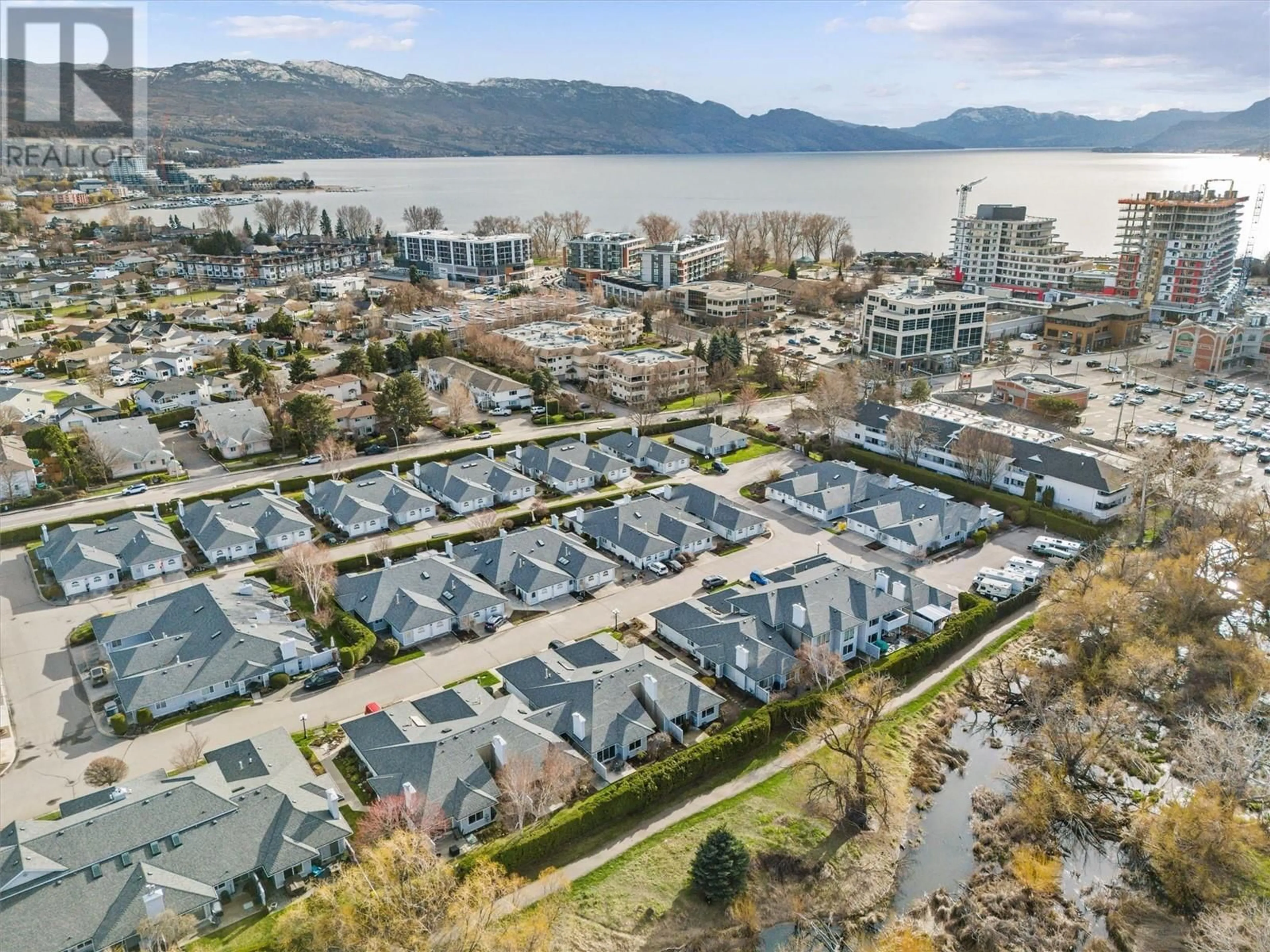 A pic from outside/outdoor area/front of a property/back of a property/a pic from drone, water/lake/river/ocean view for 9 - 3370 CASORSO ROAD, Kelowna British Columbia V1W3J2