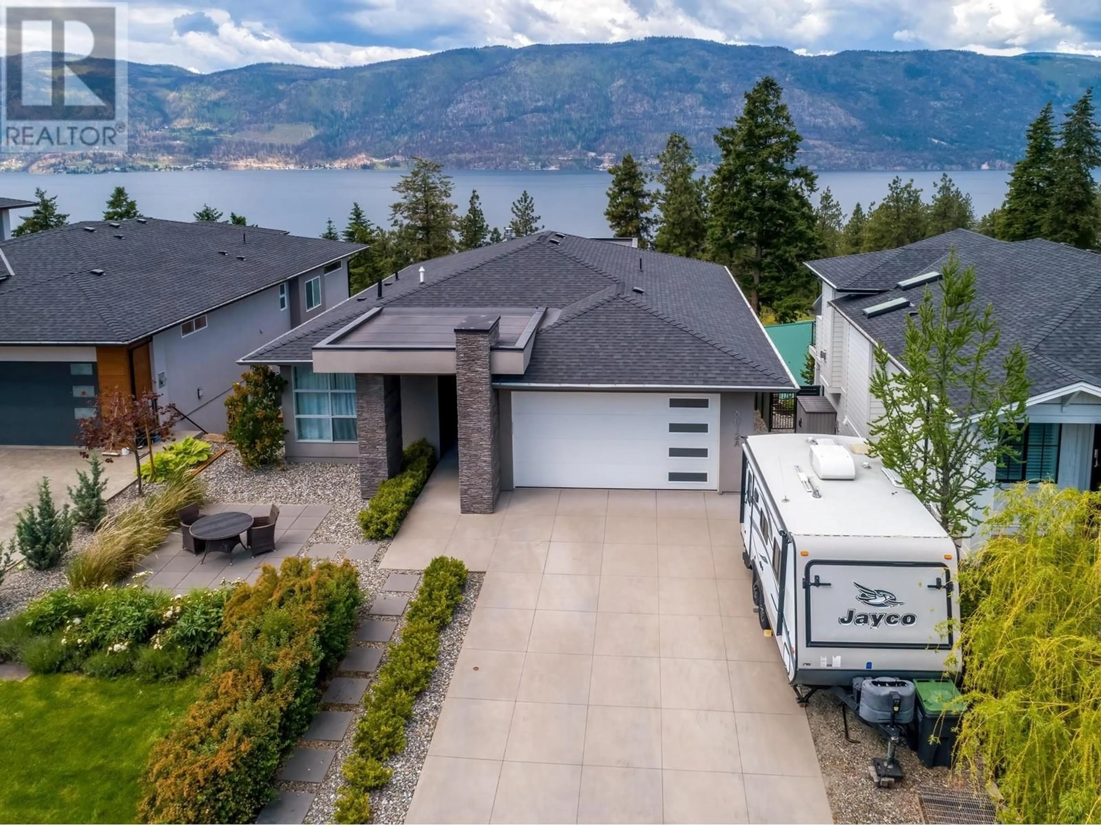 A pic from outside/outdoor area/front of a property/back of a property/a pic from drone, unknown for 8612 HERITAGE DRIVE, Lake Country British Columbia V4V2W2