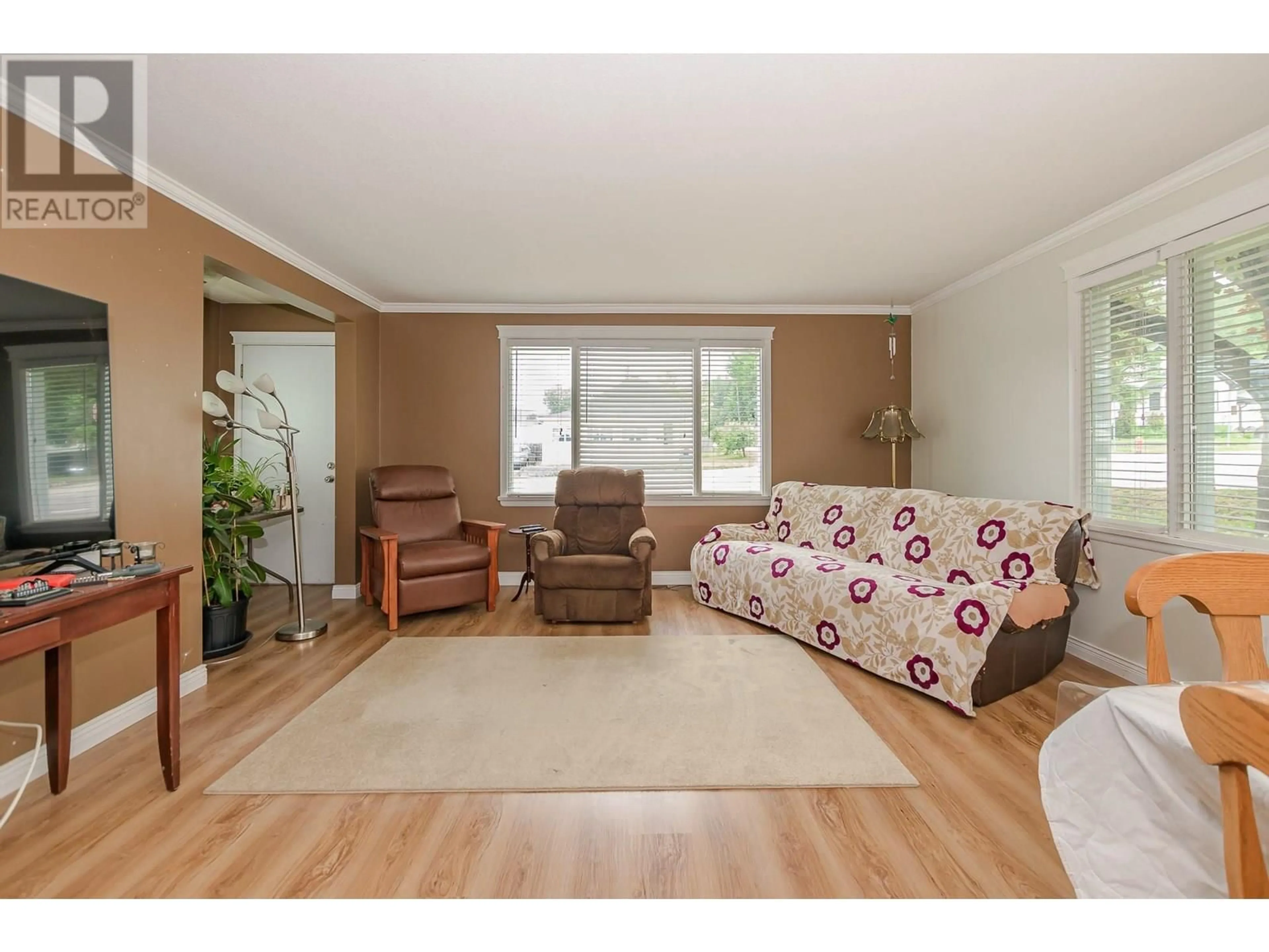 Living room with furniture, wood/laminate floor for 729 STANLEY AVENUE, Enderby British Columbia V0E1V1