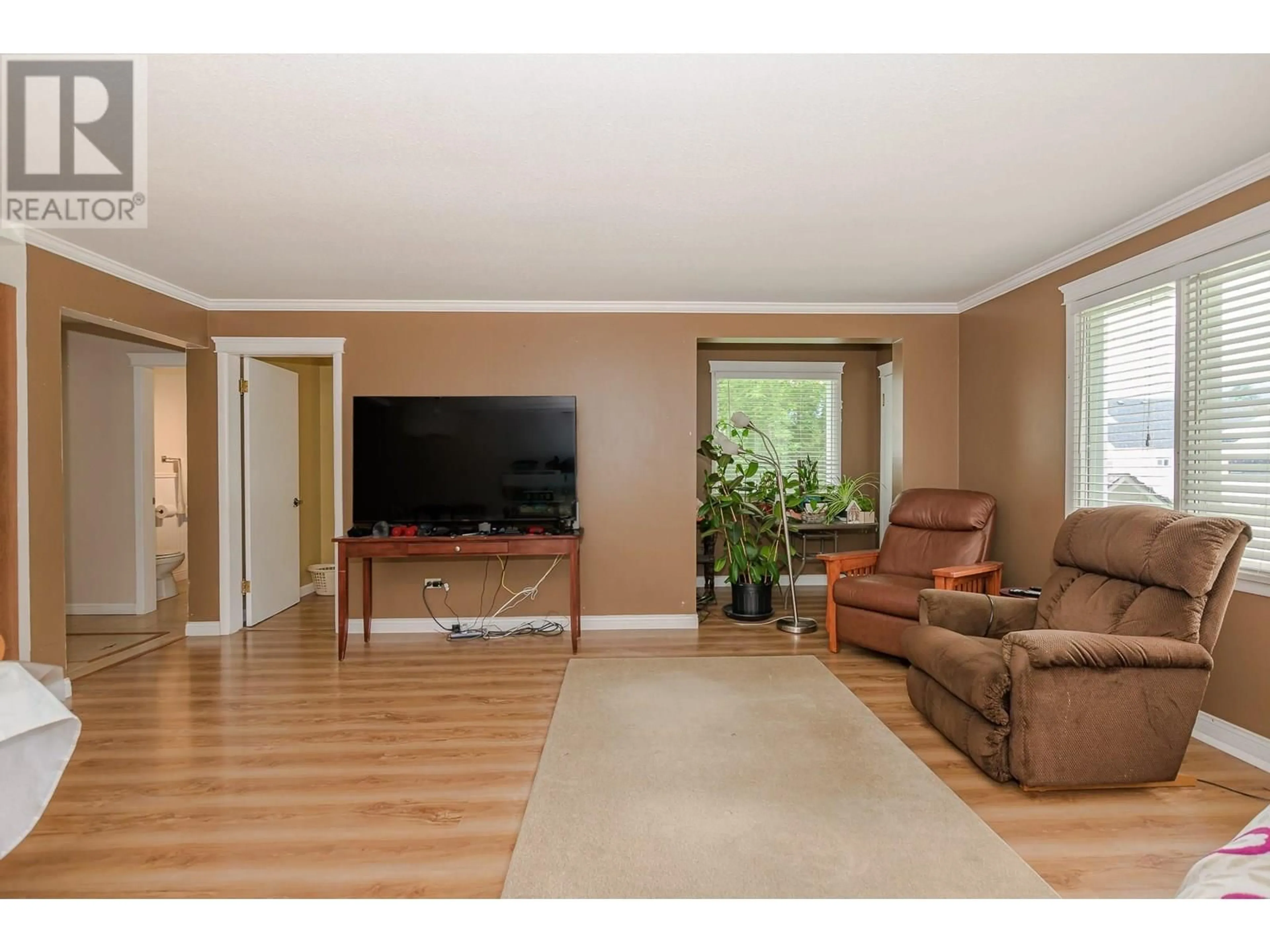 Living room with furniture, wood/laminate floor for 729 STANLEY AVENUE, Enderby British Columbia V0E1V1