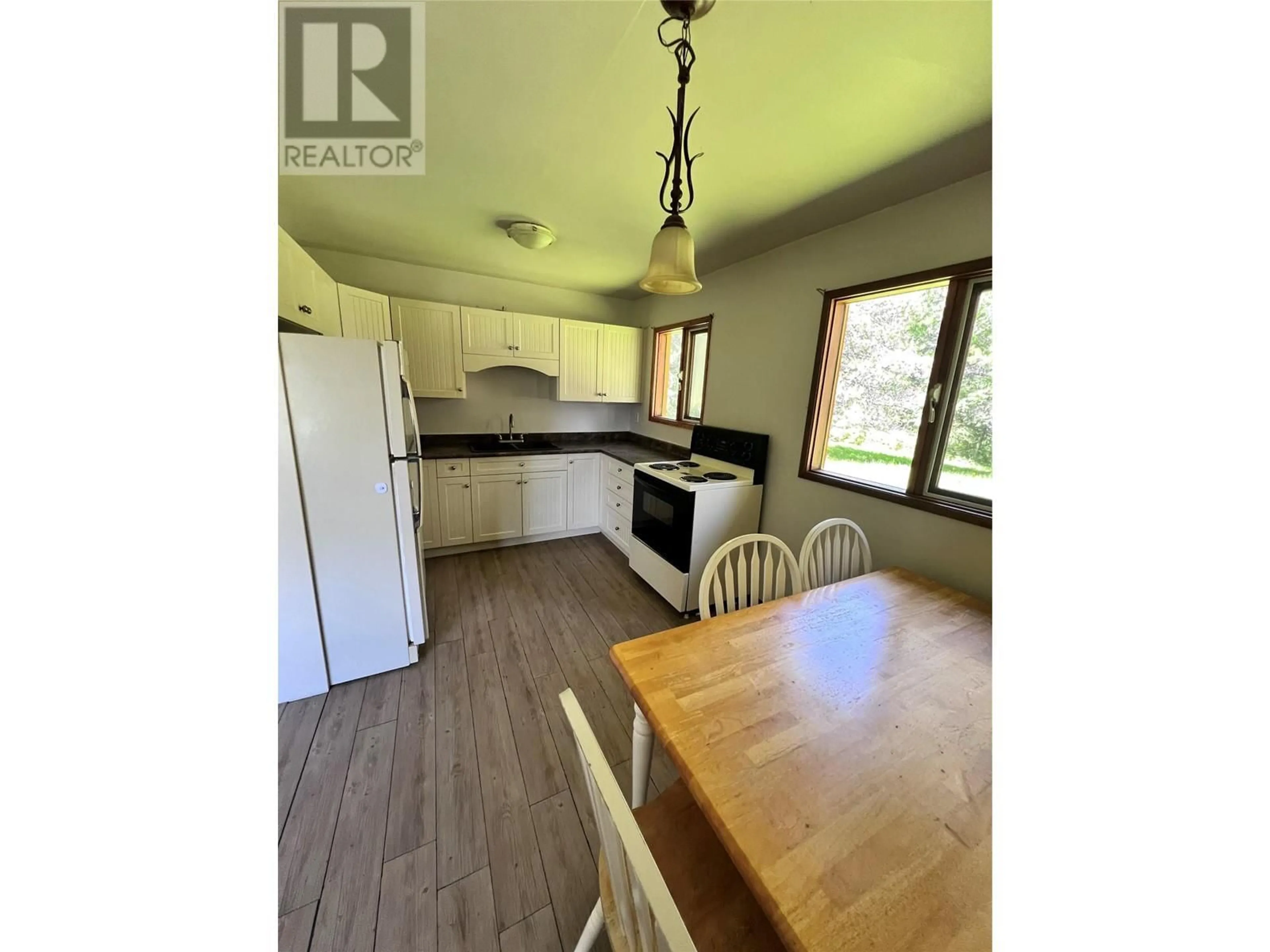 Open concept kitchen, wood/laminate floor for 44 HOLLINGSWORTH ROAD, Cherryville British Columbia V0E2G3