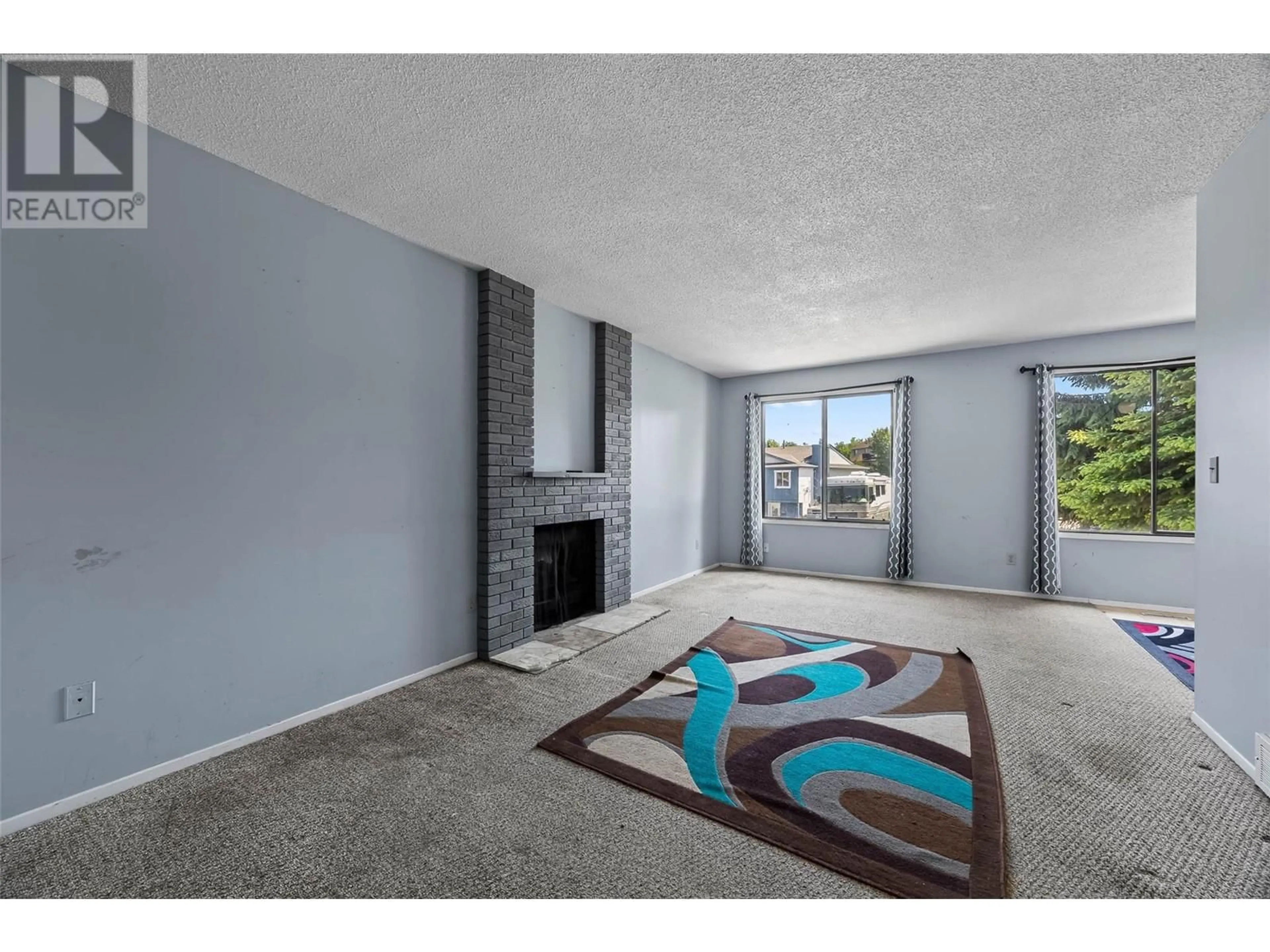 Living room with furniture, carpet floor for 356 HOLLYBURN DRIVE, Kamloops British Columbia V2E2M7