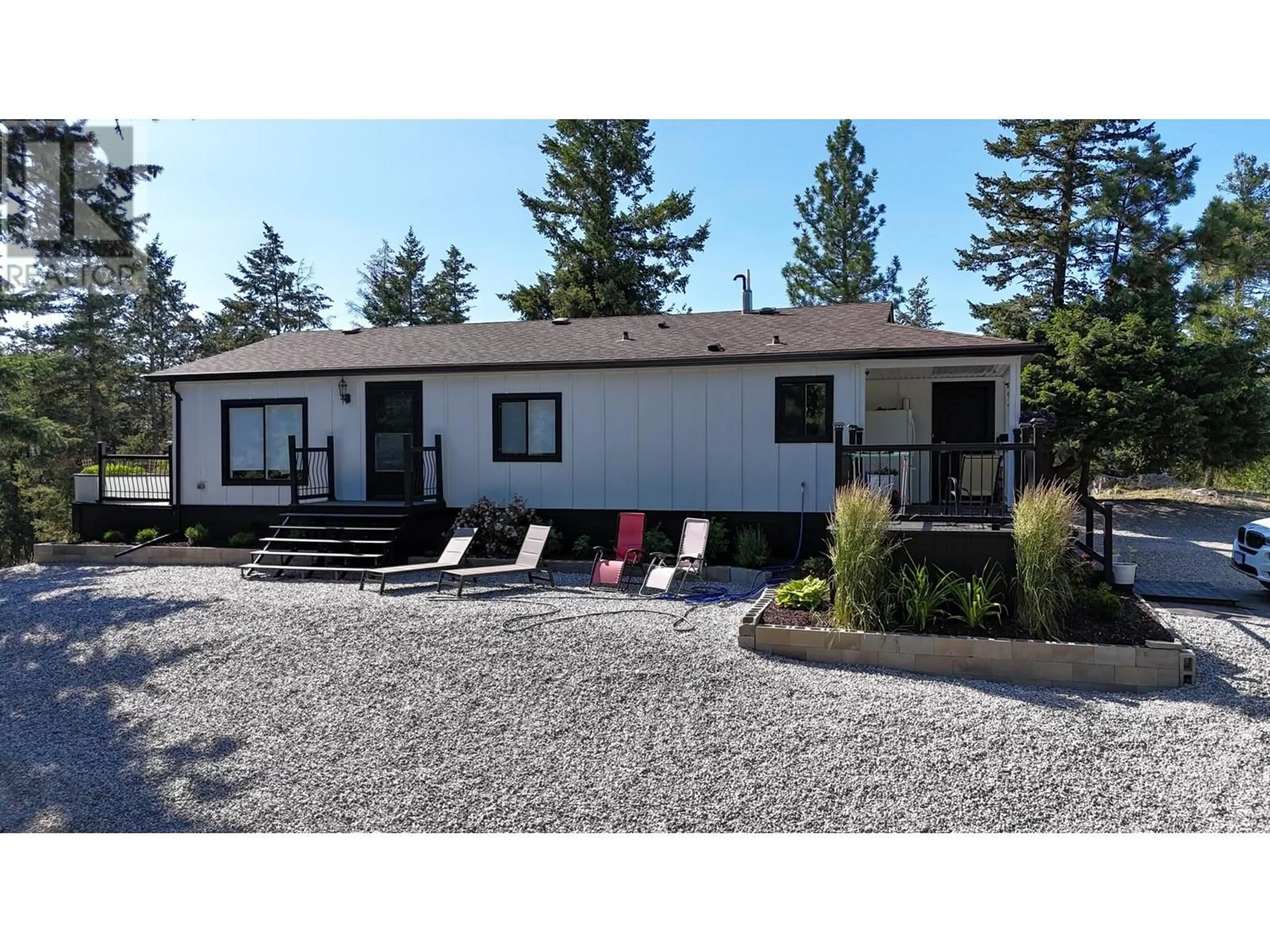 Home with vinyl exterior material, street for 338 HOWARDS ROAD, Vernon British Columbia V1T6Y5