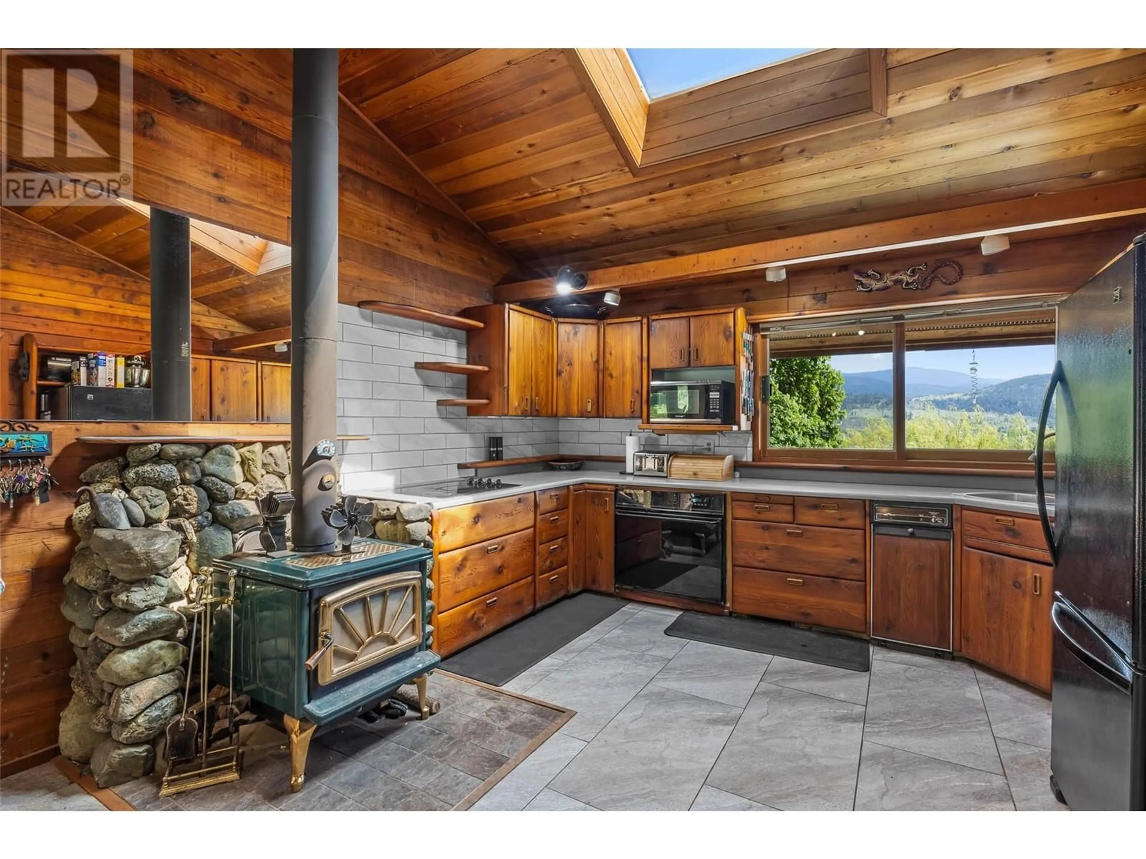 Rustic kitchen, ceramic/tile floor for 7050 WESTSYDE ROAD, Kamloops British Columbia V2C1Z3