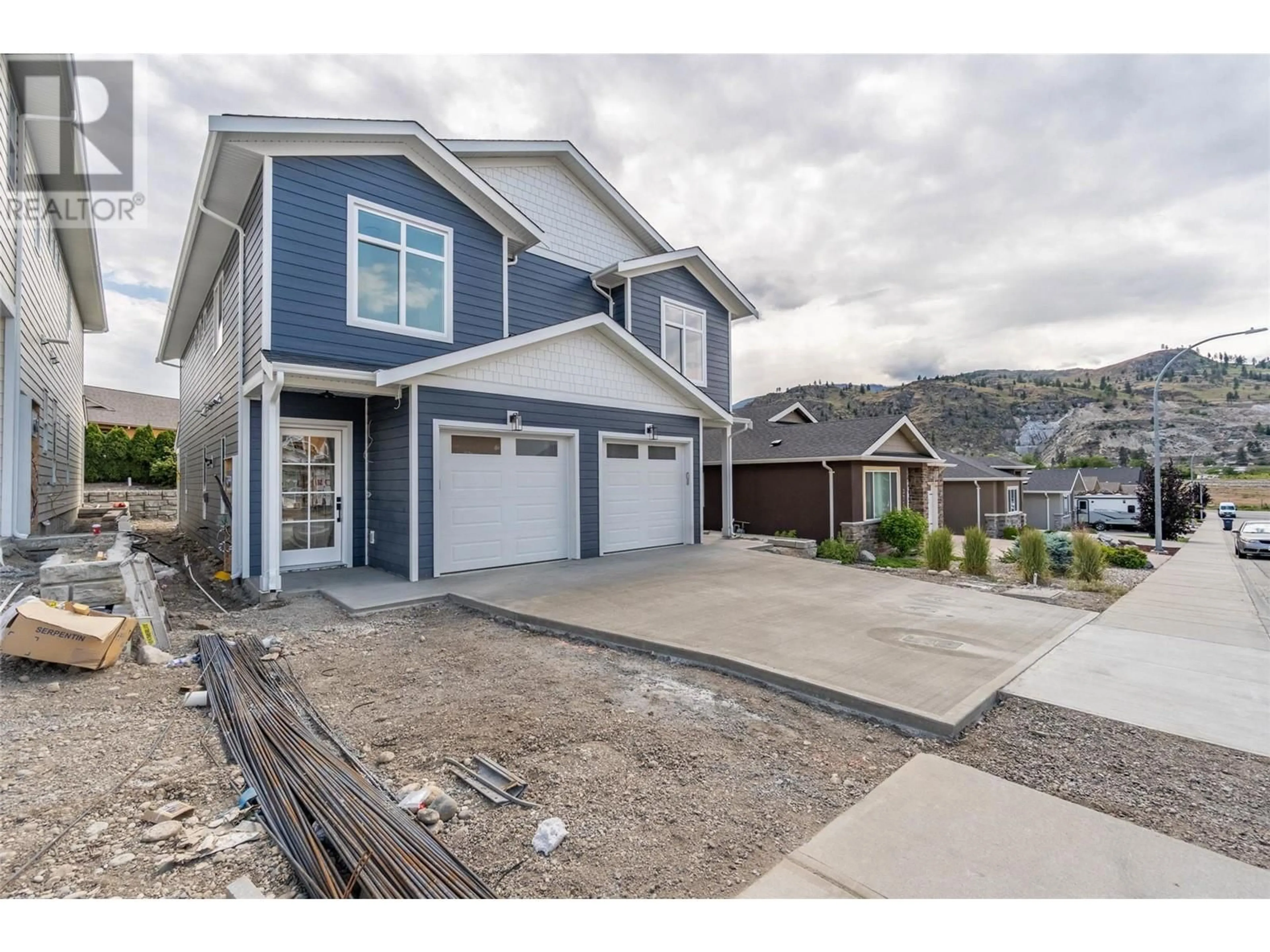 Home with vinyl exterior material, street for 383 CHARDONNAY AVENUE, Oliver British Columbia V0H1T4