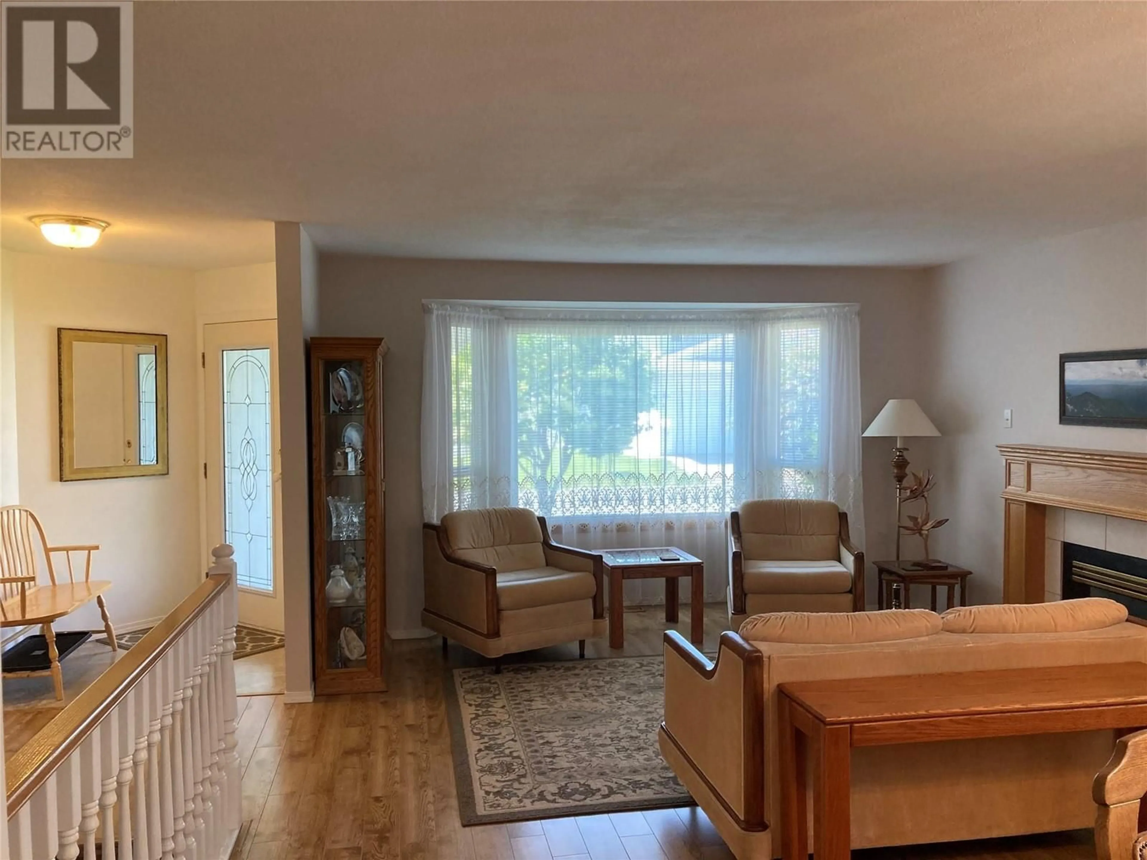 Living room with furniture, wood/laminate floor for 13 - 2655 WESTSYDE ROAD, Kamloops British Columbia V2B7C7