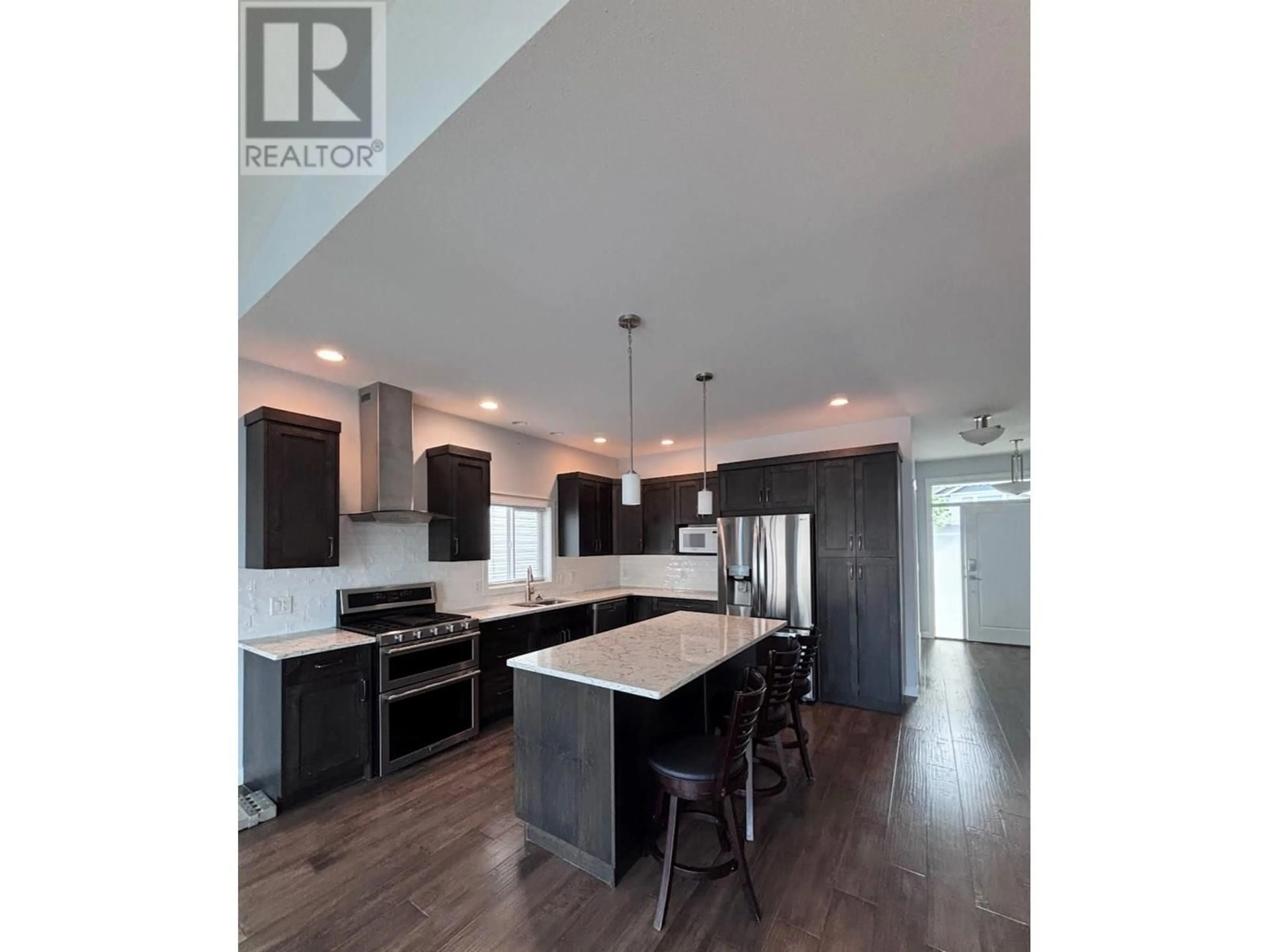 Open concept kitchen, wood/laminate floor for 2158 DOUBLETREE CRESCENT, Kamloops British Columbia V2b0G8