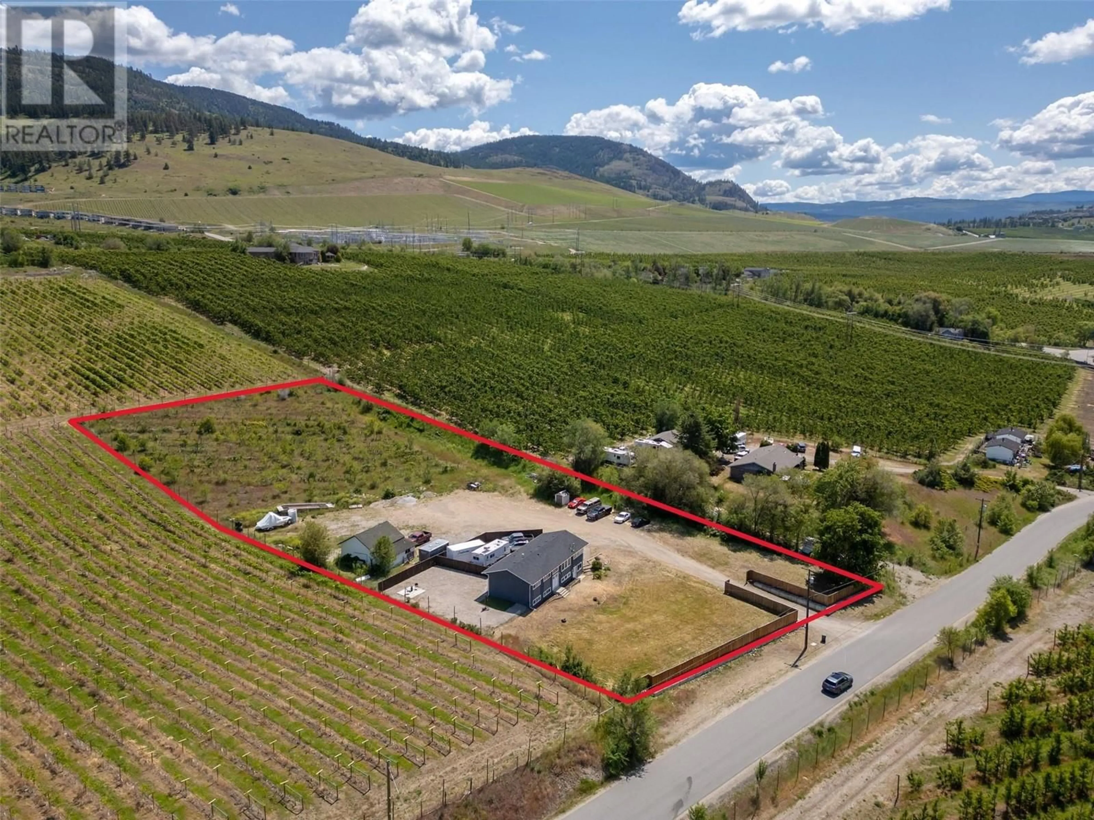 A pic from outside/outdoor area/front of a property/back of a property/a pic from drone, mountain view for 1476 LATTA ROAD, Kelowna British Columbia V1P1B4