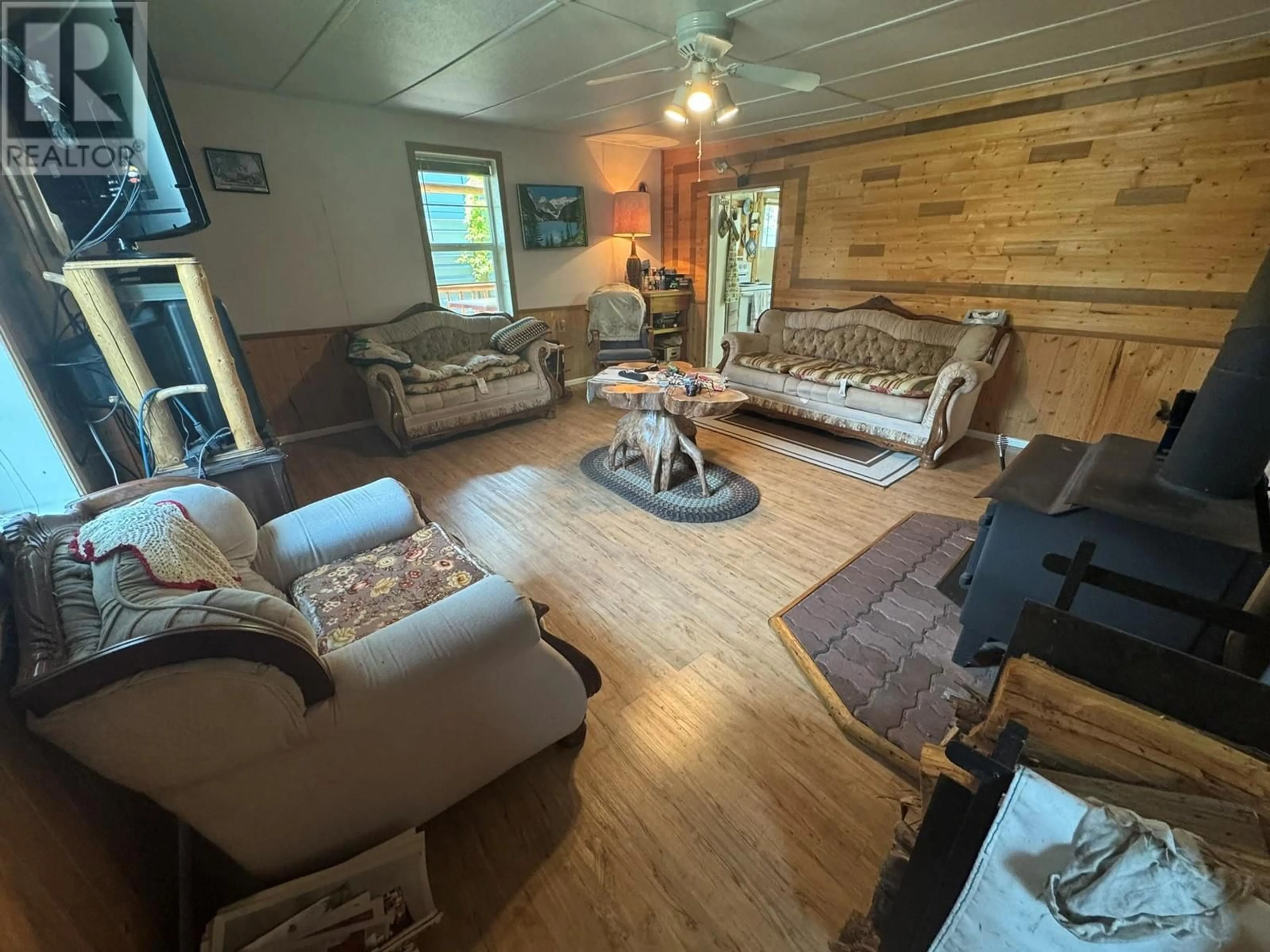 Living room with furniture, wood/laminate floor for 2614 OTTER AVENUE, Coalmont-Tulameen British Columbia V0X1W0