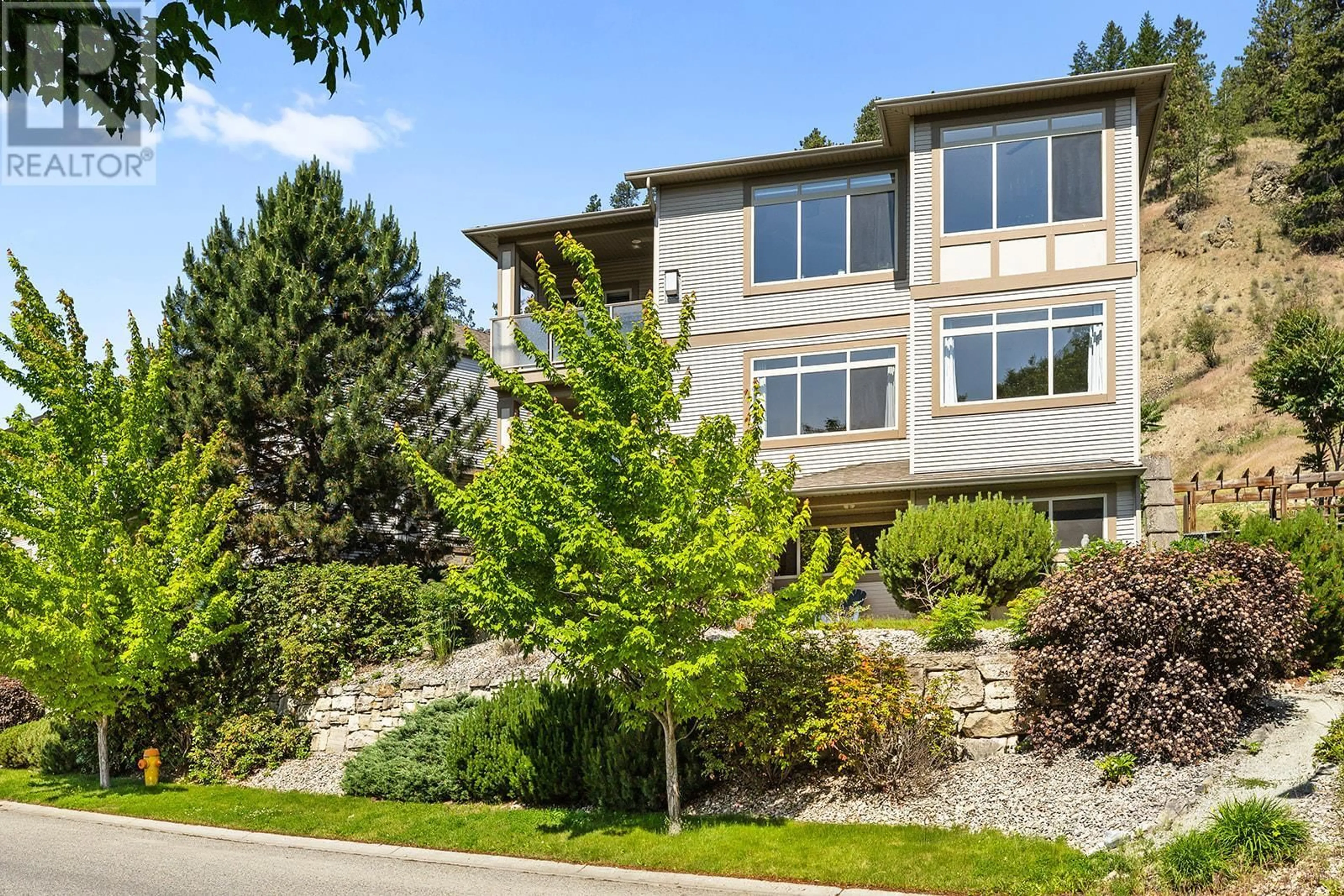 Home with brick exterior material, street for 115 - 550 GLENMEADOWS ROAD, Kelowna British Columbia V1V1X3