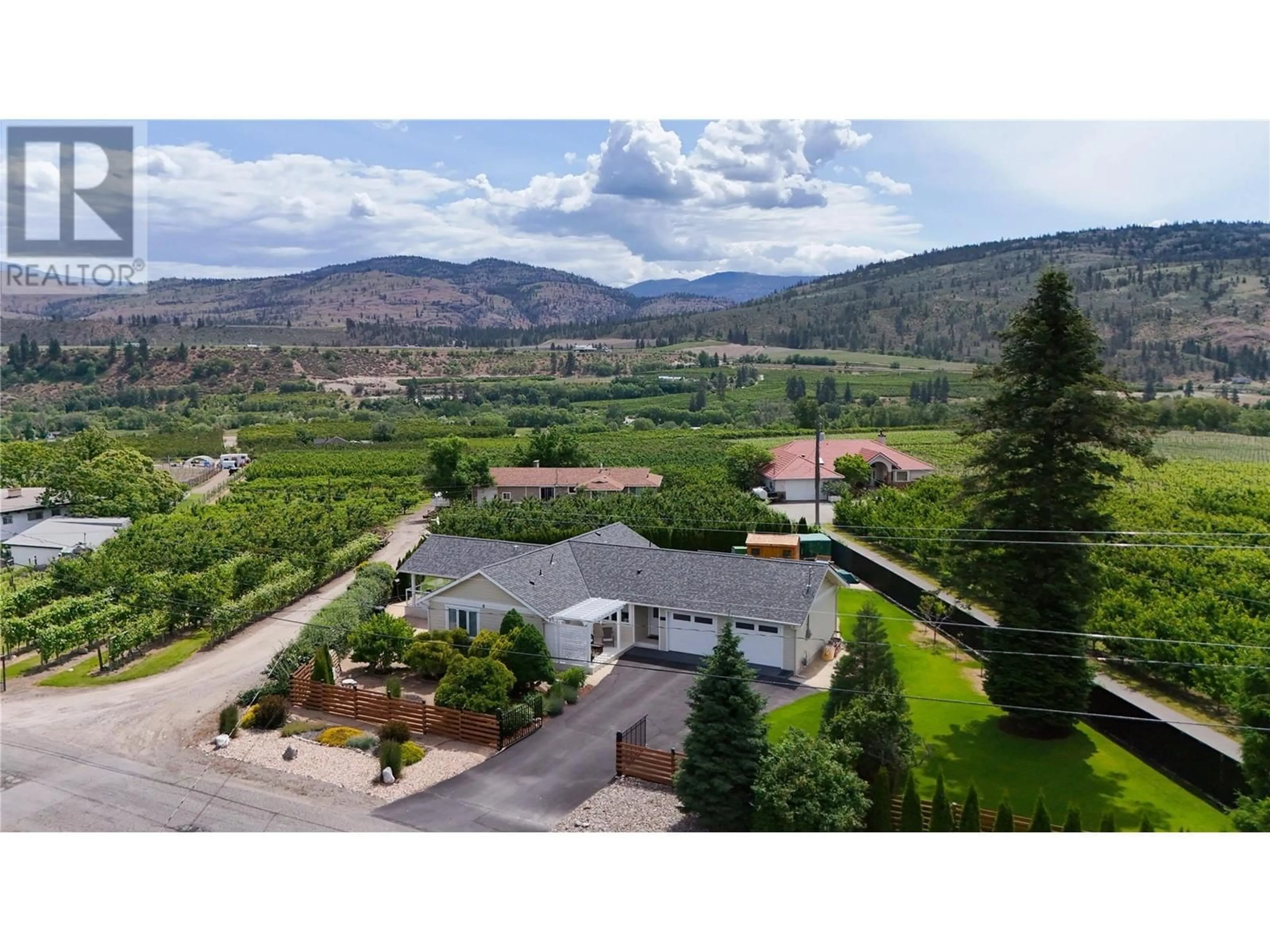 A pic from outside/outdoor area/front of a property/back of a property/a pic from drone, mountain view for 5609 YARROW STREET, Oliver British Columbia V0H1T9