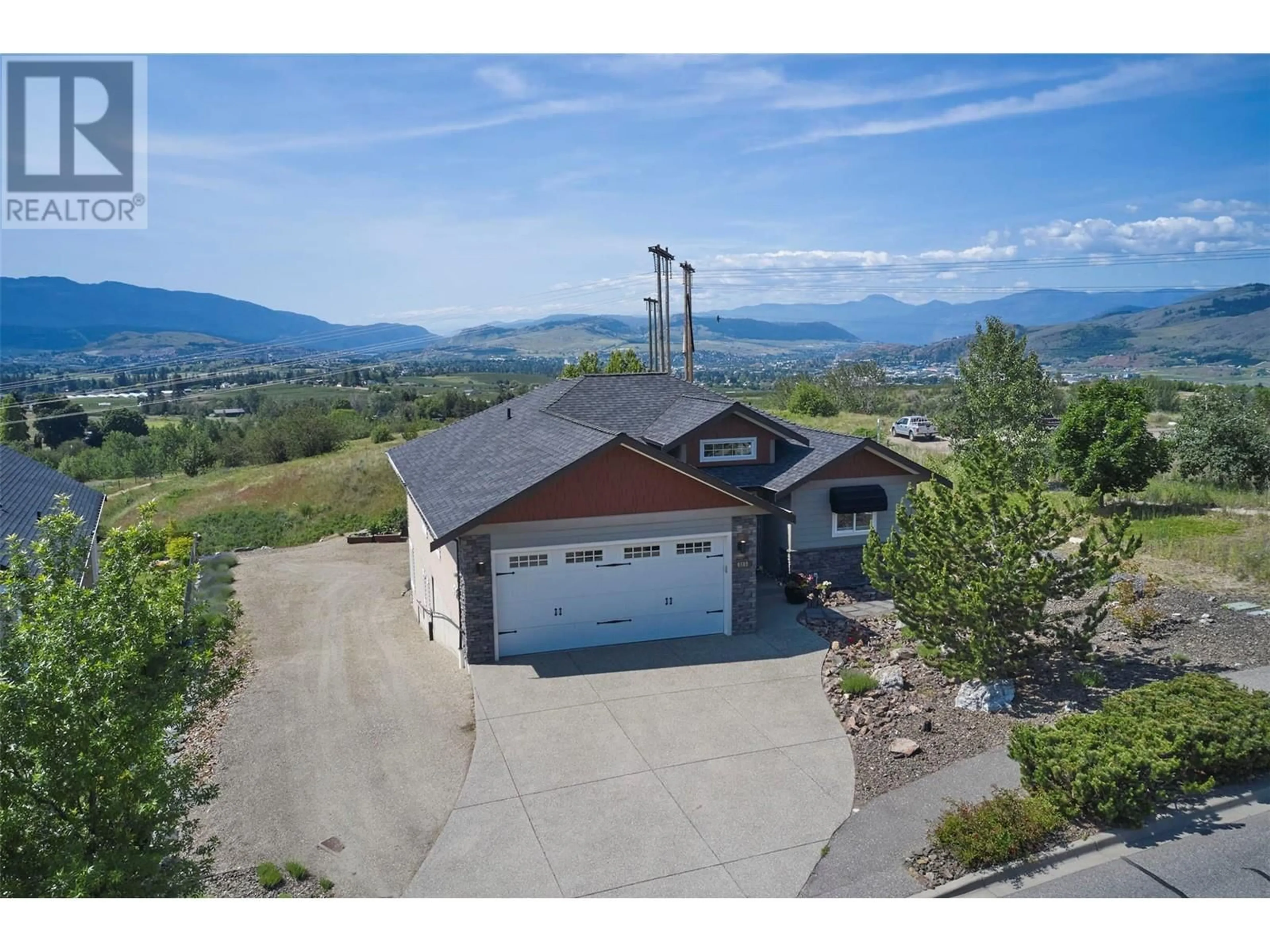 A pic from outside/outdoor area/front of a property/back of a property/a pic from drone, mountain view for 6518 BLACKCOMB WAY, Vernon British Columbia V1B4E1