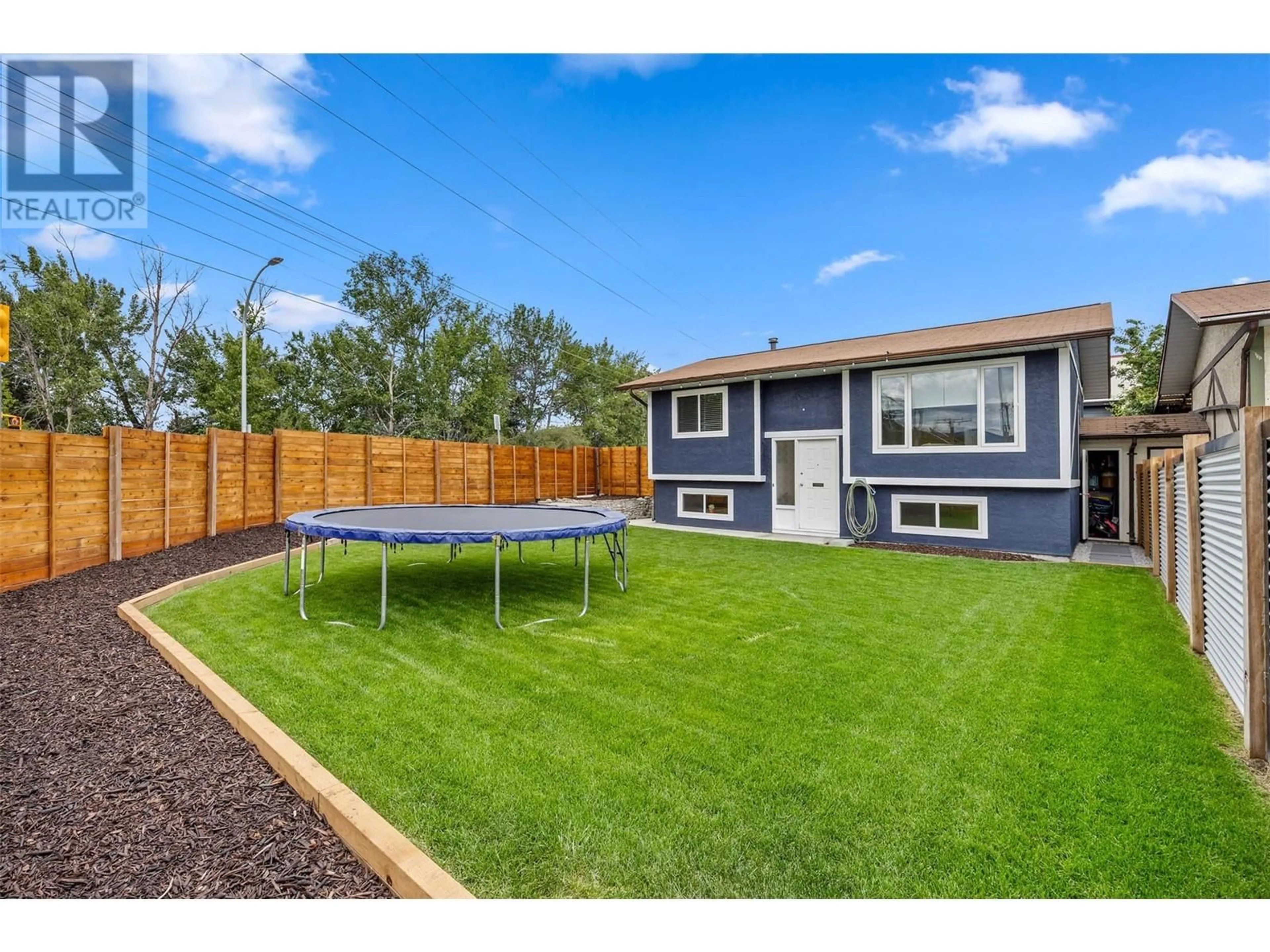 A pic from outside/outdoor area/front of a property/back of a property/a pic from drone, street for 1700 ATKINSON STREET, Penticton British Columbia V2A7M6