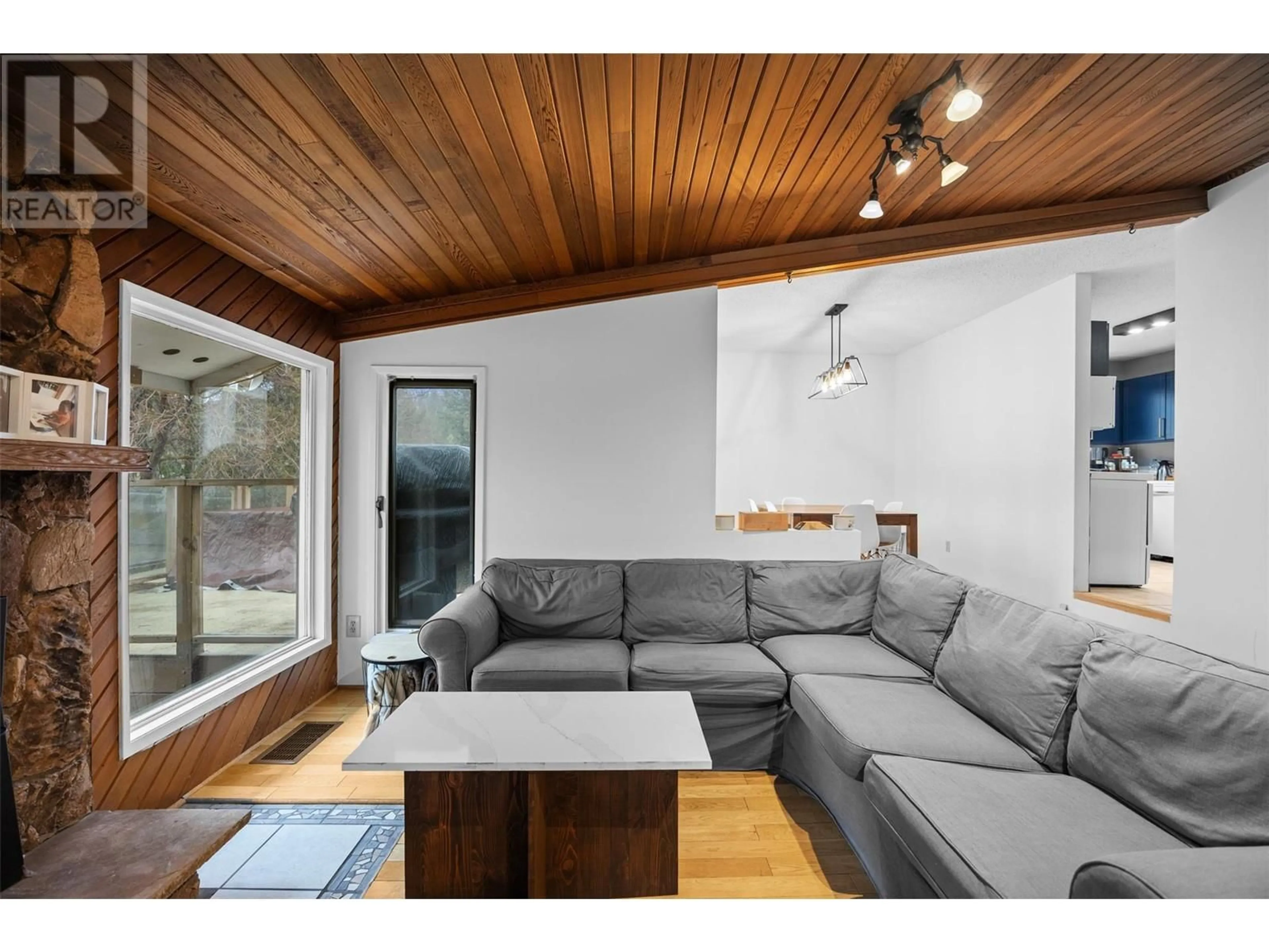 Living room with furniture, wood/laminate floor for 37 BRECCIA DRIVE, Logan Lake British Columbia V0K1W0