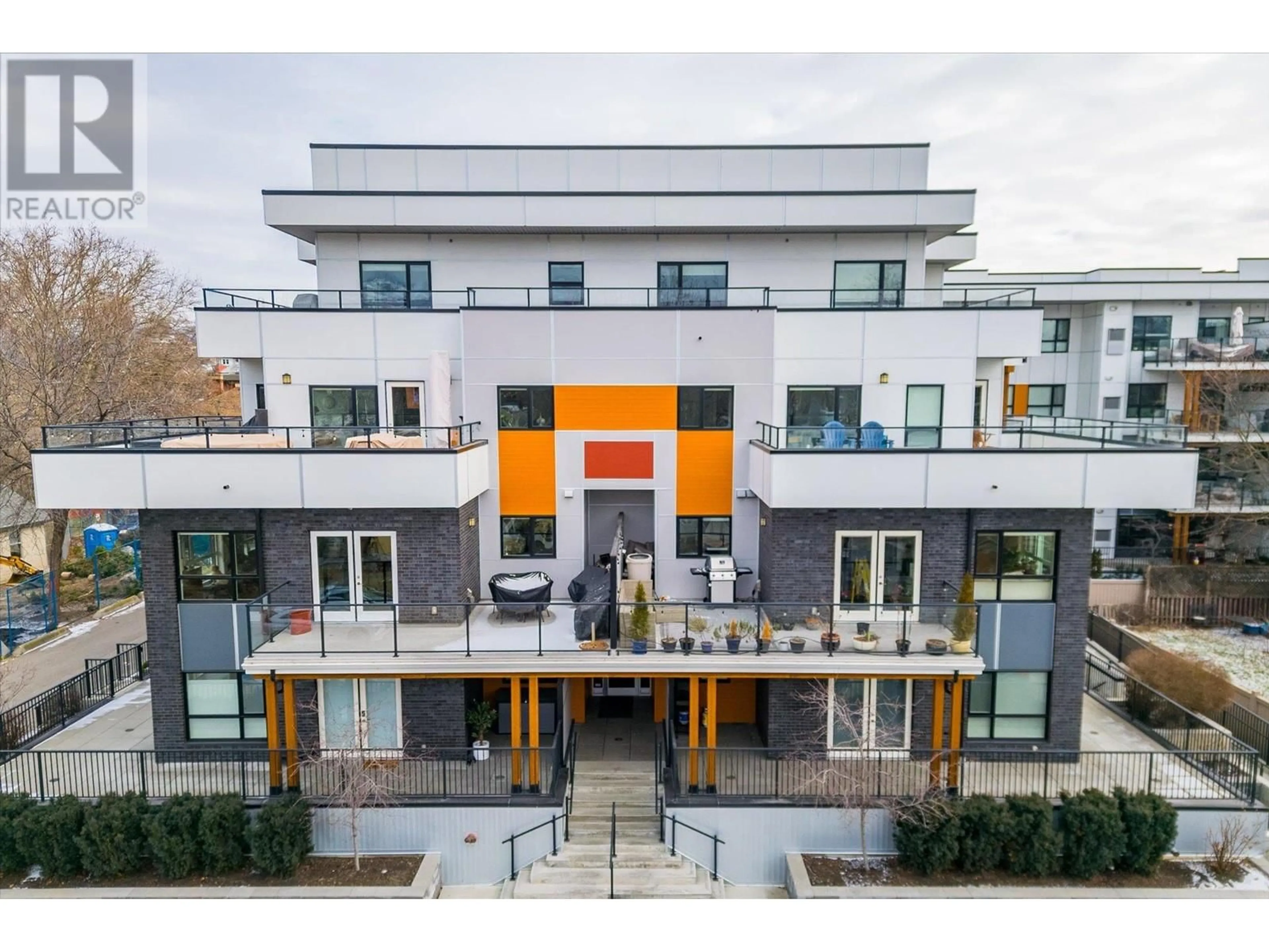 A pic from outside/outdoor area/front of a property/back of a property/a pic from drone, unknown for 105 - 1883 WATER STREET, Kelowna British Columbia V1Y1K4