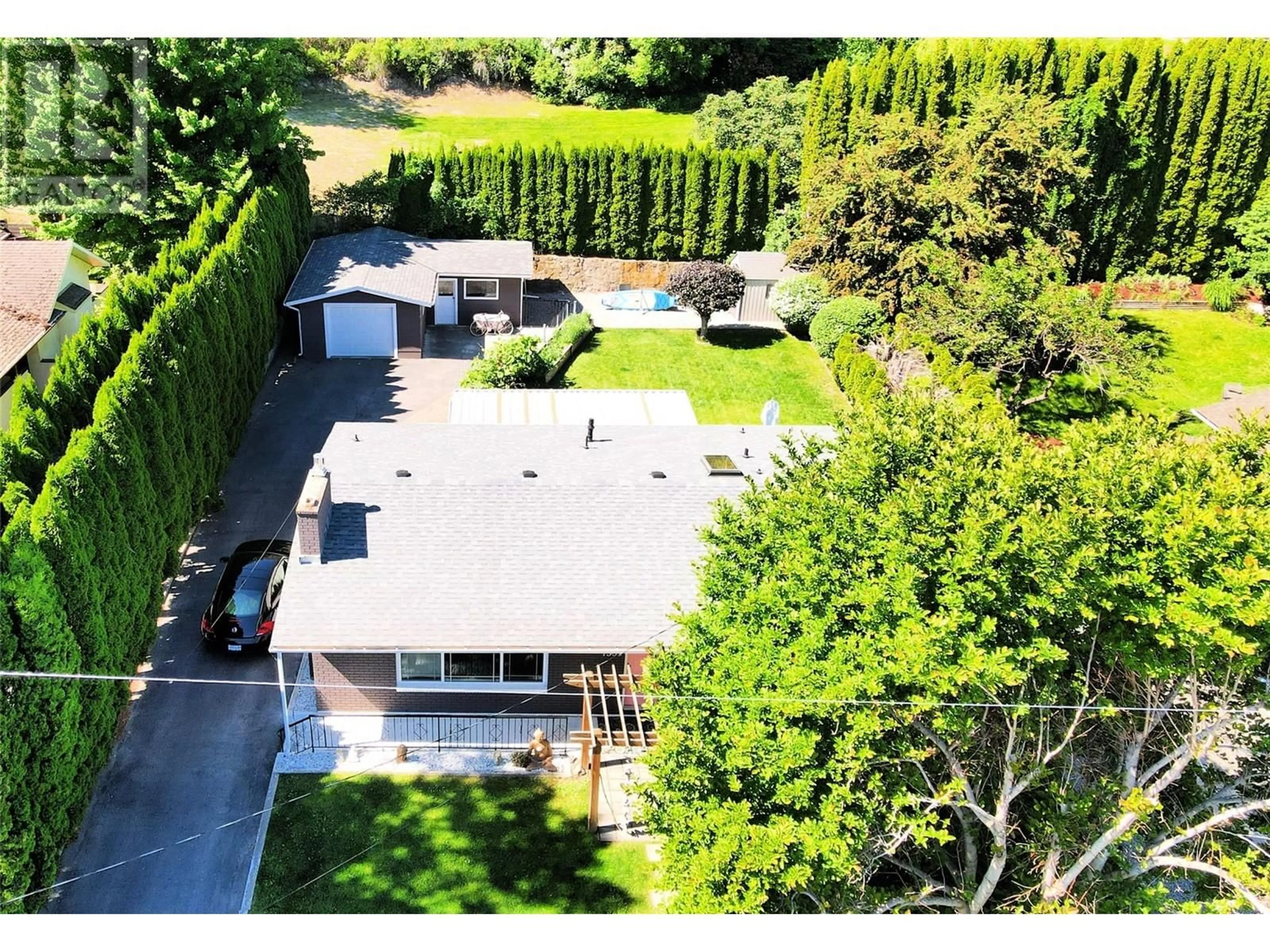A pic from outside/outdoor area/front of a property/back of a property/a pic from drone, street for 7509 HIGGIN AVENUE, Summerland British Columbia V0H1Z6