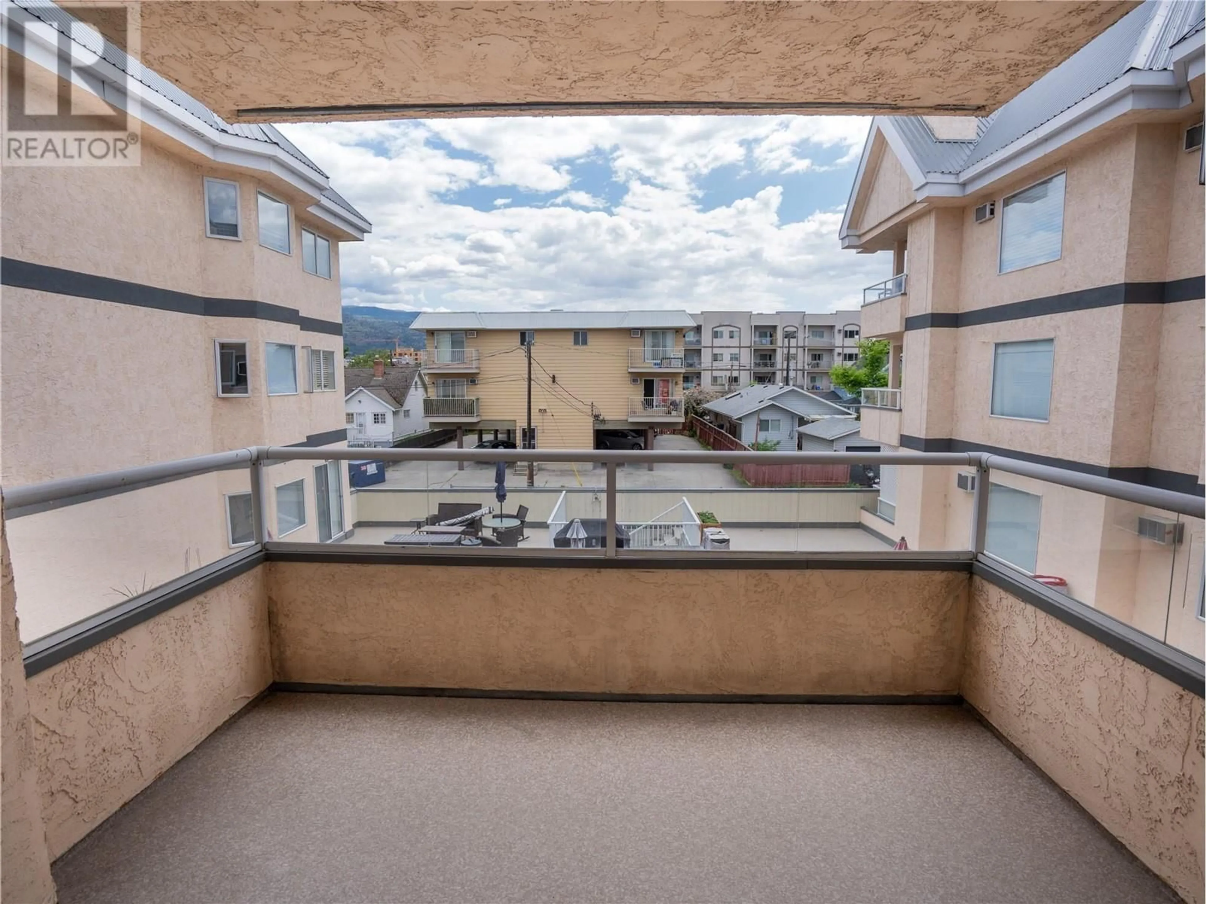 Balcony in the apartment, city buildings view from balcony for 308 - 374 WINNIPEG STREET, Penticton British Columbia V2A5M5