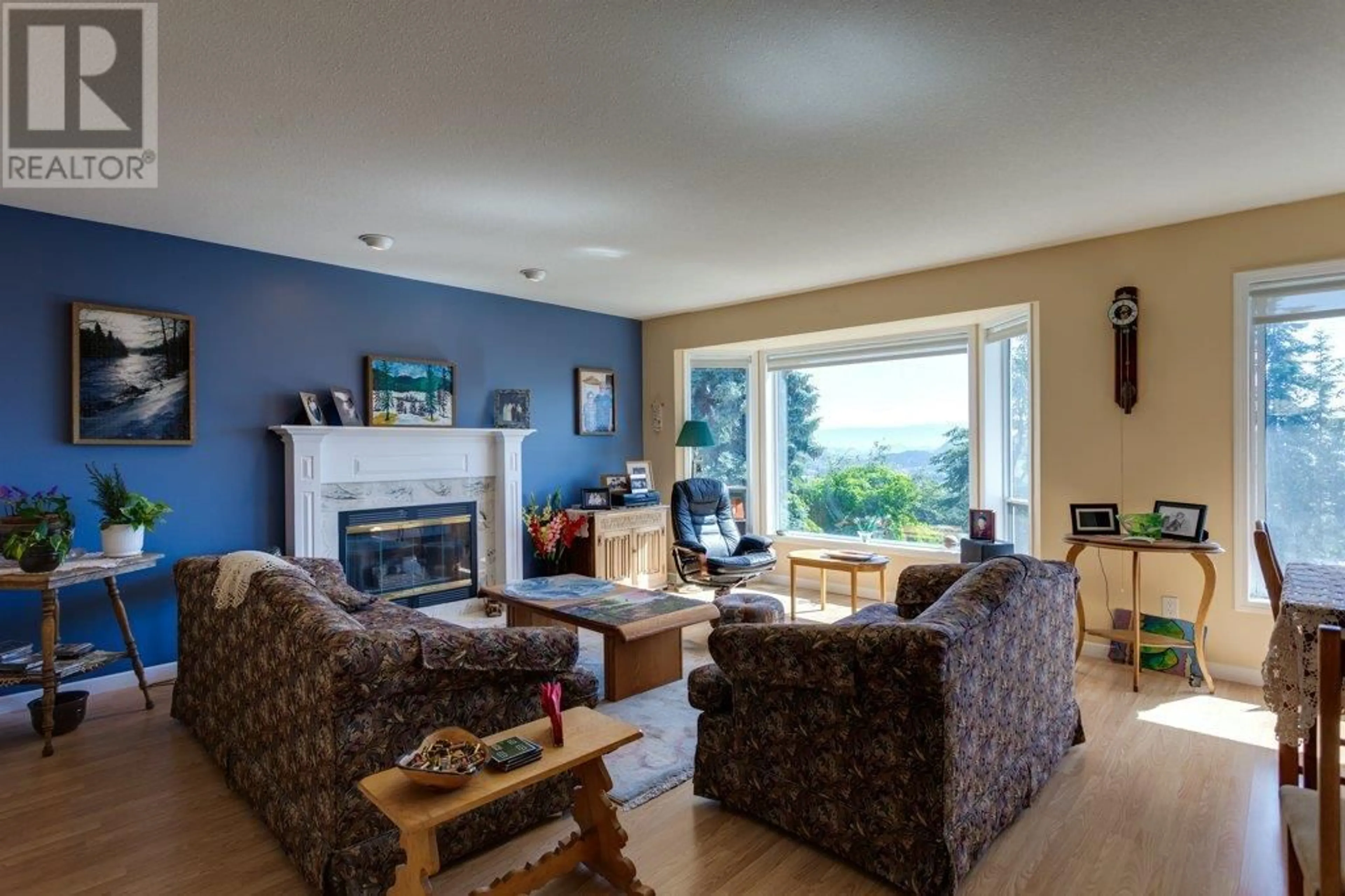 Living room with furniture, wood/laminate floor for 3549 GATES ROAD, West Kelowna British Columbia V4T1A2