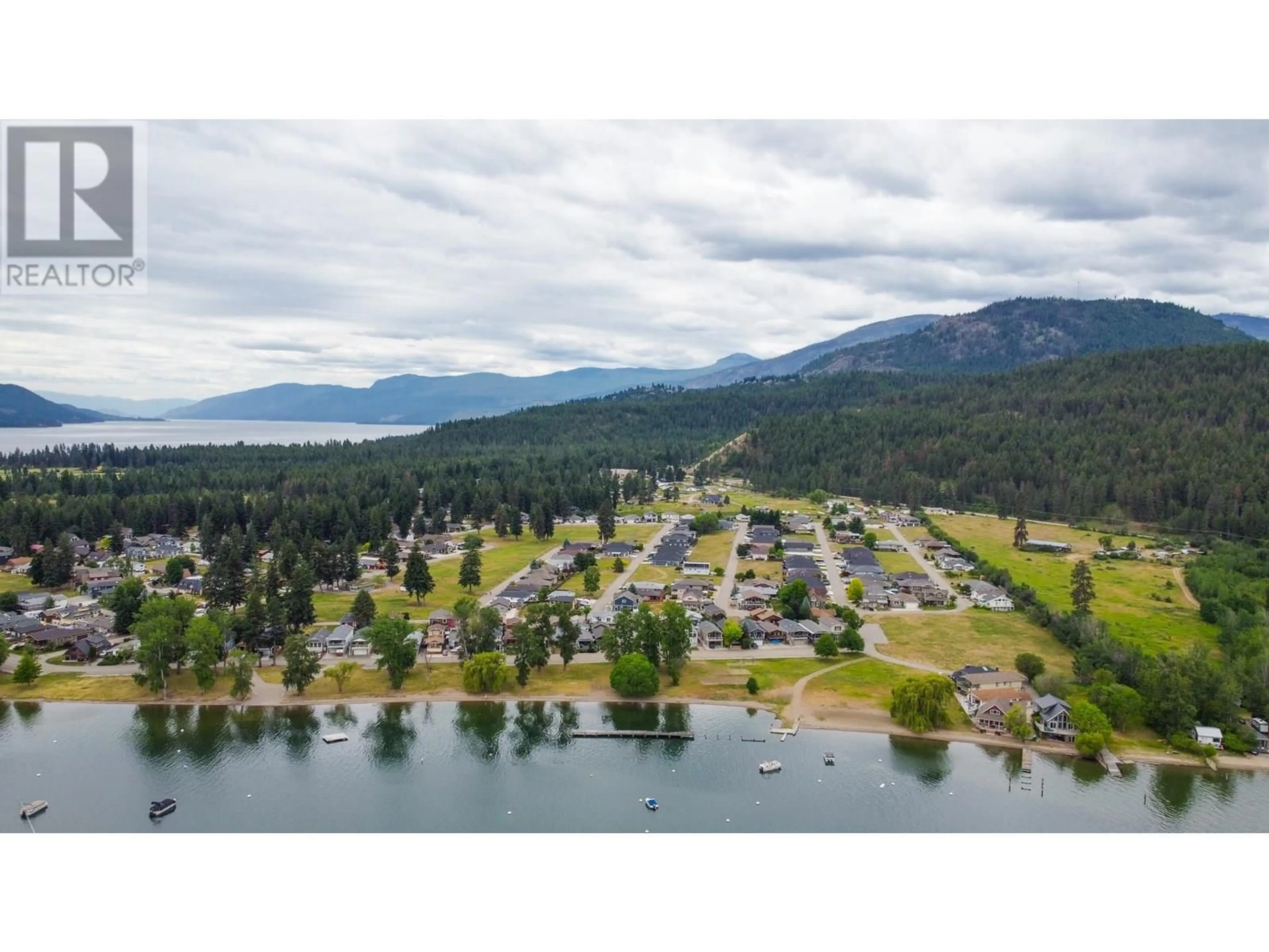 A pic from outside/outdoor area/front of a property/back of a property/a pic from drone, water/lake/river/ocean view for 15 LAKESHORE DRIVE, Vernon British Columbia V1H2A1