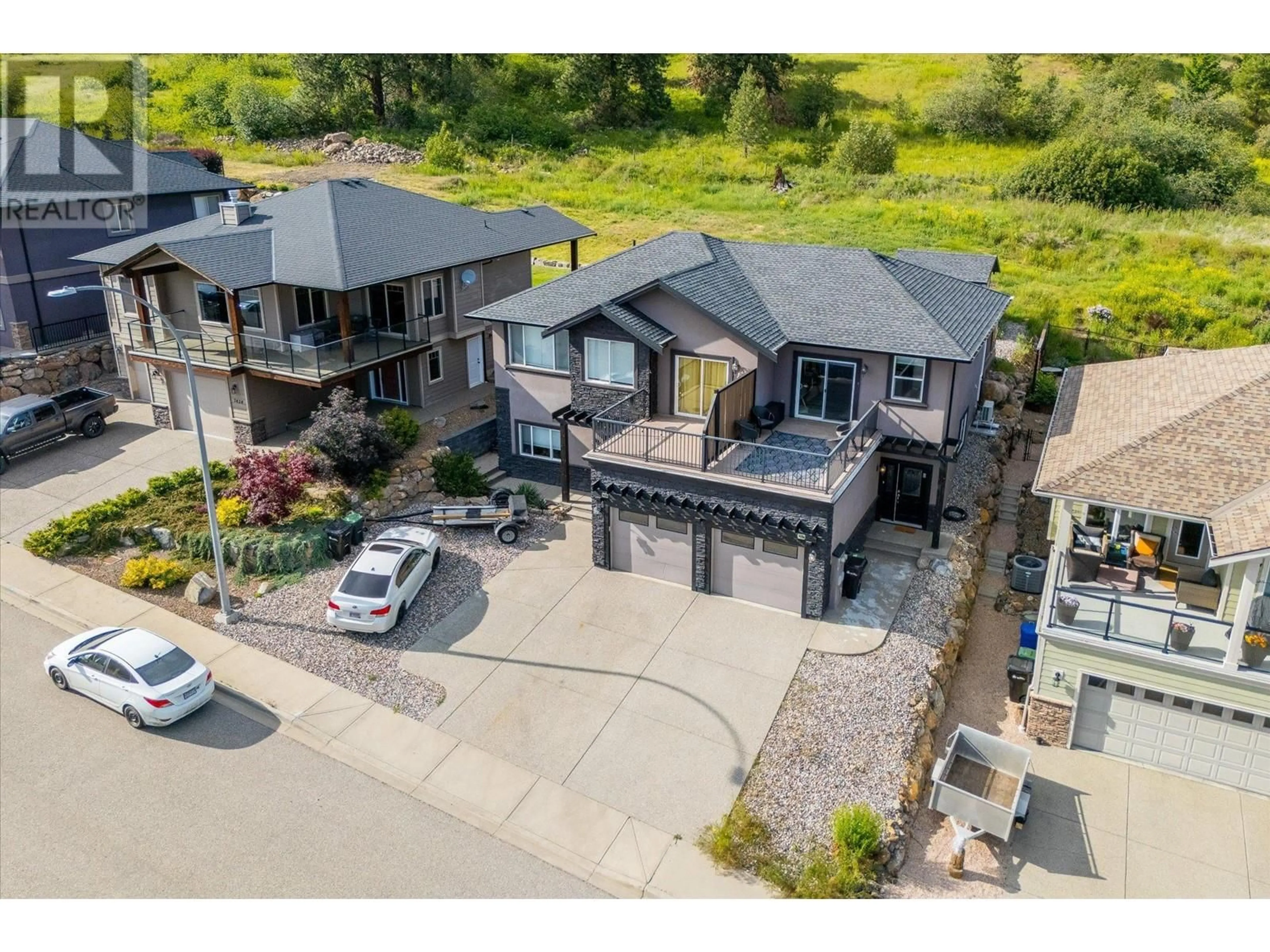 A pic from outside/outdoor area/front of a property/back of a property/a pic from drone, street for 7420 SUN PEAKS DRIVE, Vernon British Columbia V1B4C7