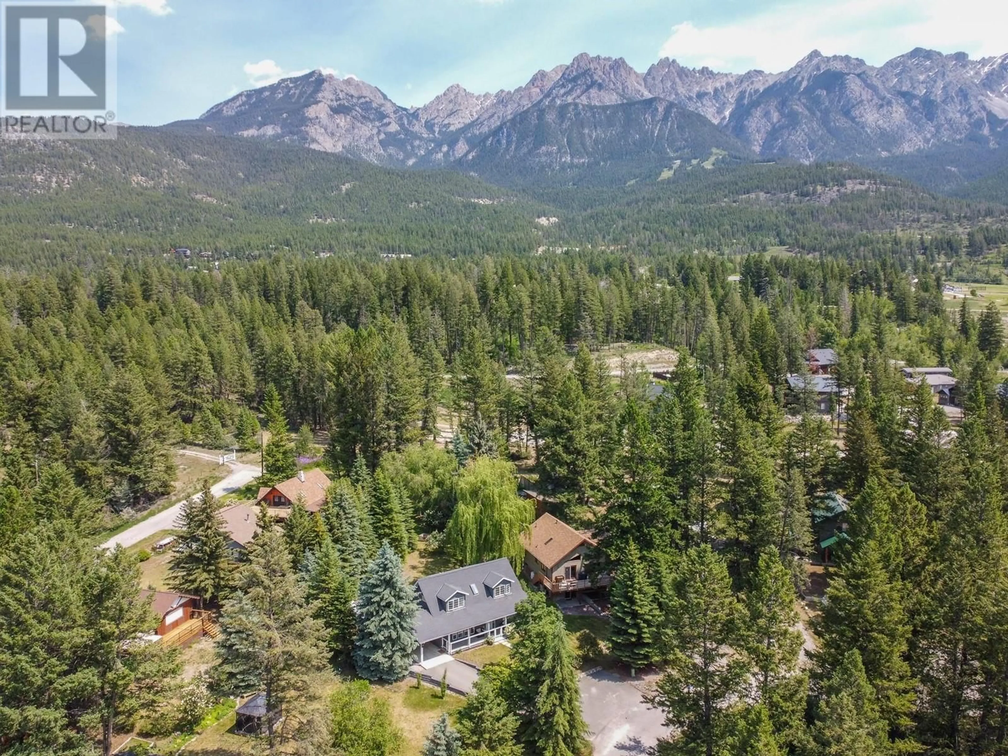 A pic from outside/outdoor area/front of a property/back of a property/a pic from drone, mountain view for 4909 MEADOWS CRESCENT, Fairmont Hot Springs British Columbia V0B1L0