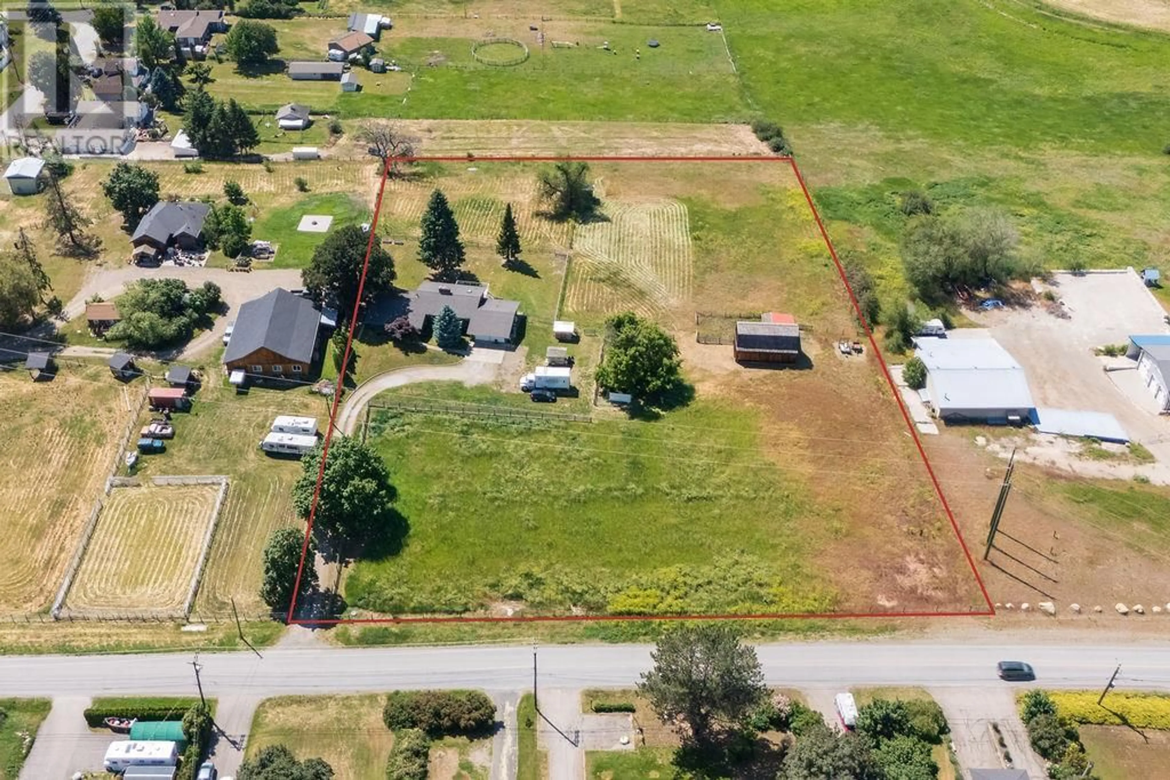 A pic from outside/outdoor area/front of a property/back of a property/a pic from drone, street for 3796 EAST VERNON ROAD, Vernon British Columbia V1B3H7