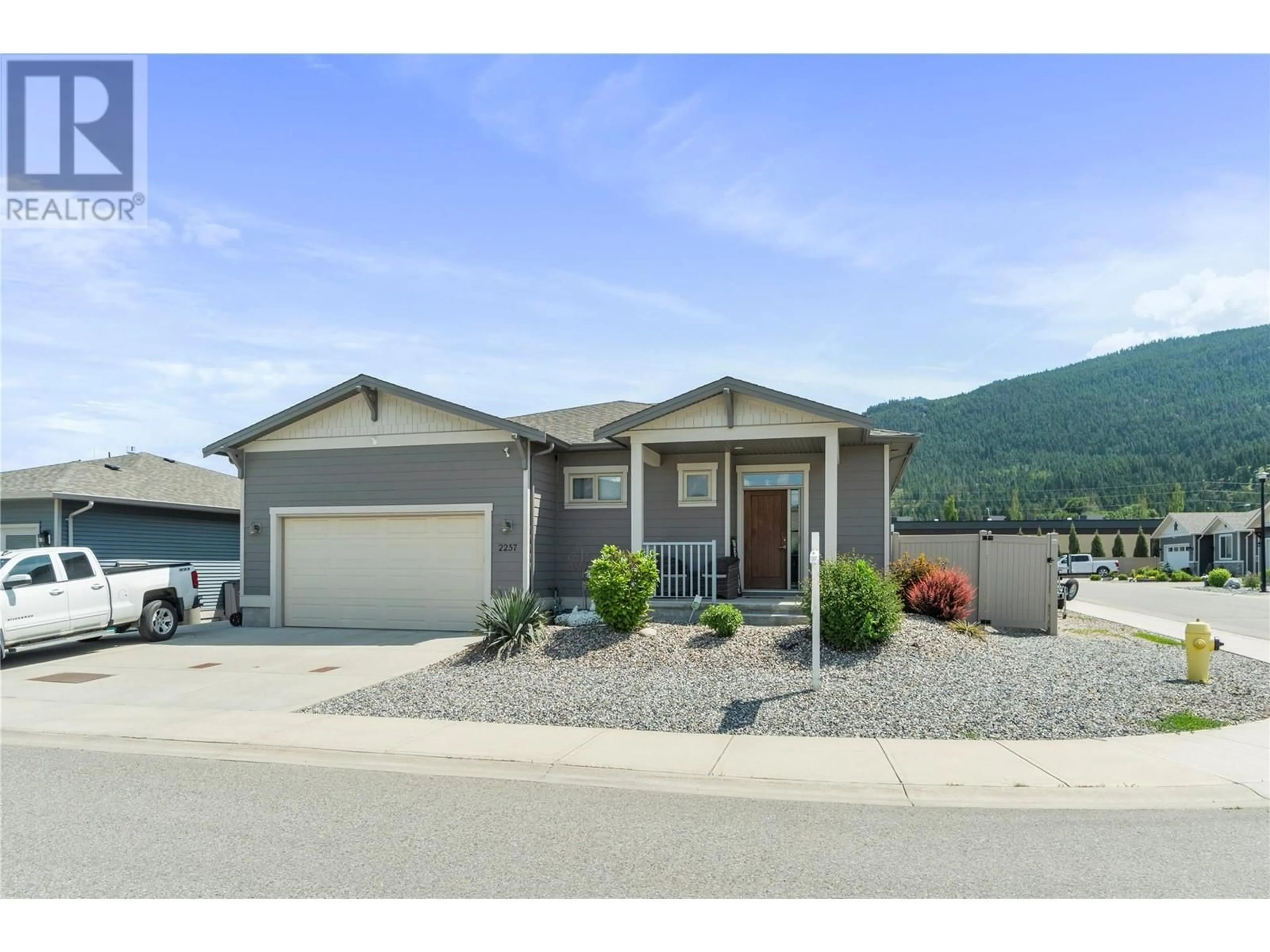 Home with vinyl exterior material, mountain view for 2257 RAHN AVENUE, Armstrong British Columbia V0E1B8