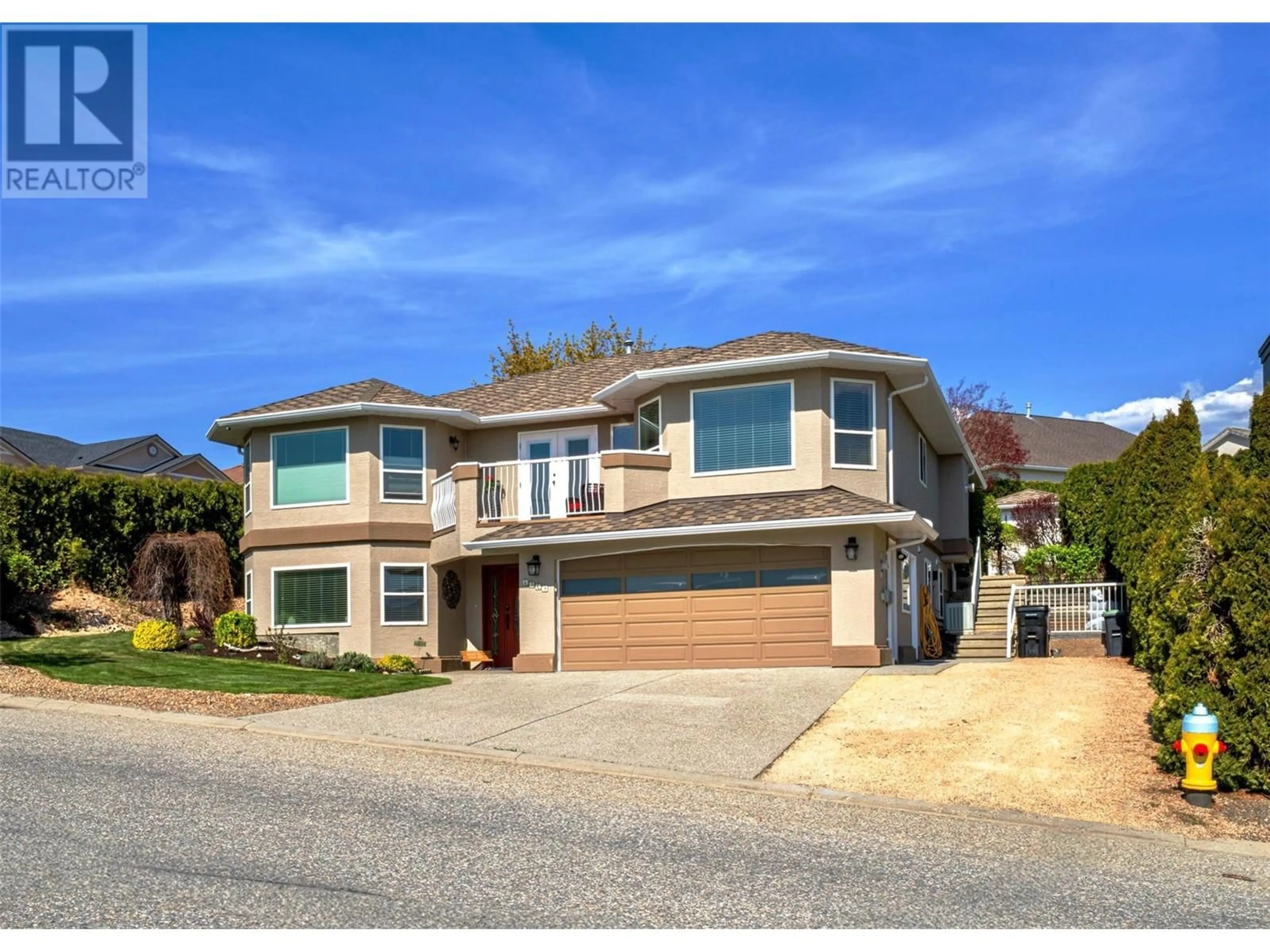 Home with vinyl exterior material, street for 6769 FOOTHILLS DRIVE, Vernon British Columbia V1B2Y3