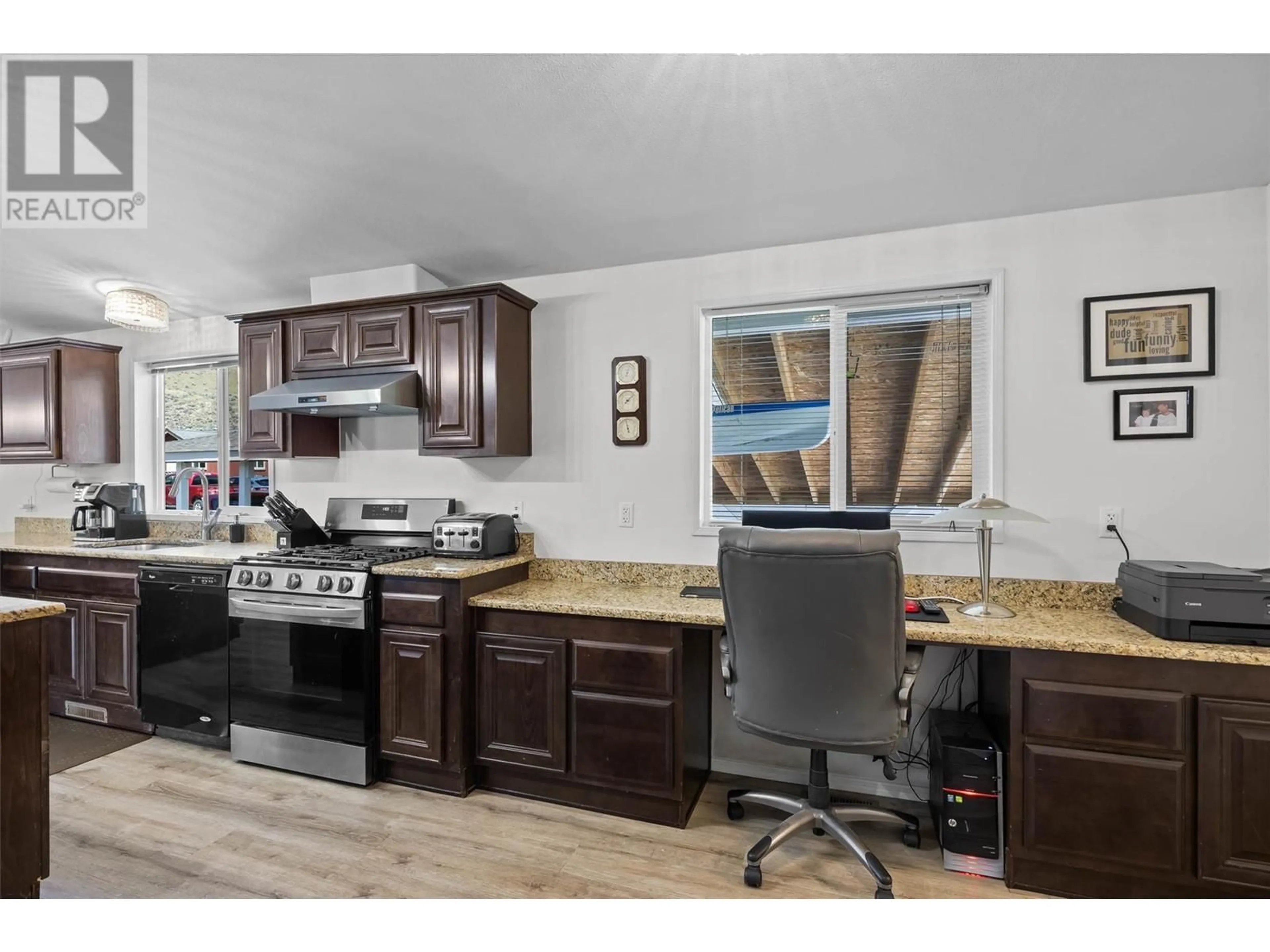 Open concept kitchen, wood/laminate floor for 1 - 712 SHUSWAP  E ROAD, Kamloops British Columbia V2H0C8