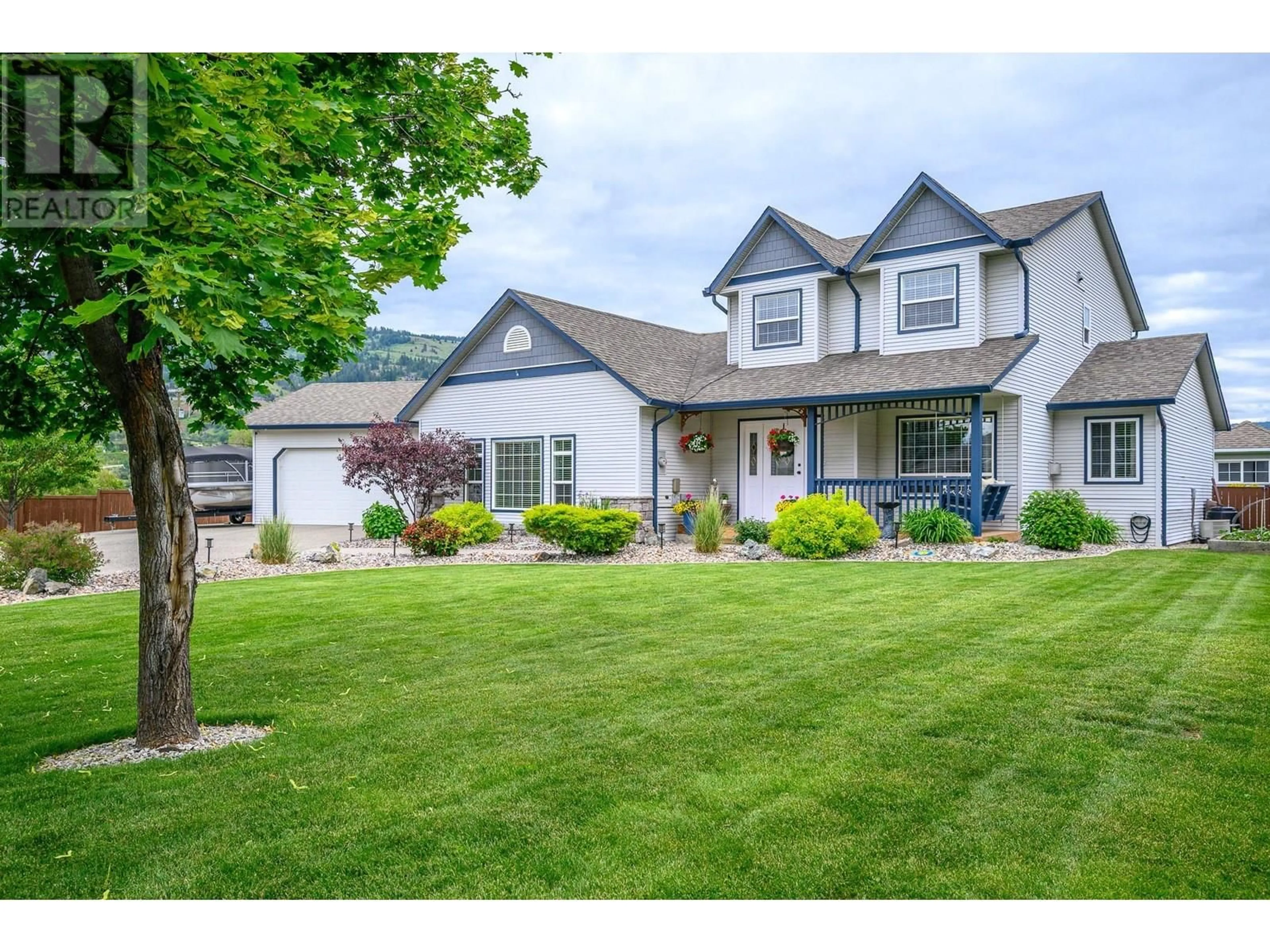 Home with vinyl exterior material, street for 241 INVERNESS DRIVE, Coldstream British Columbia V1B3V9