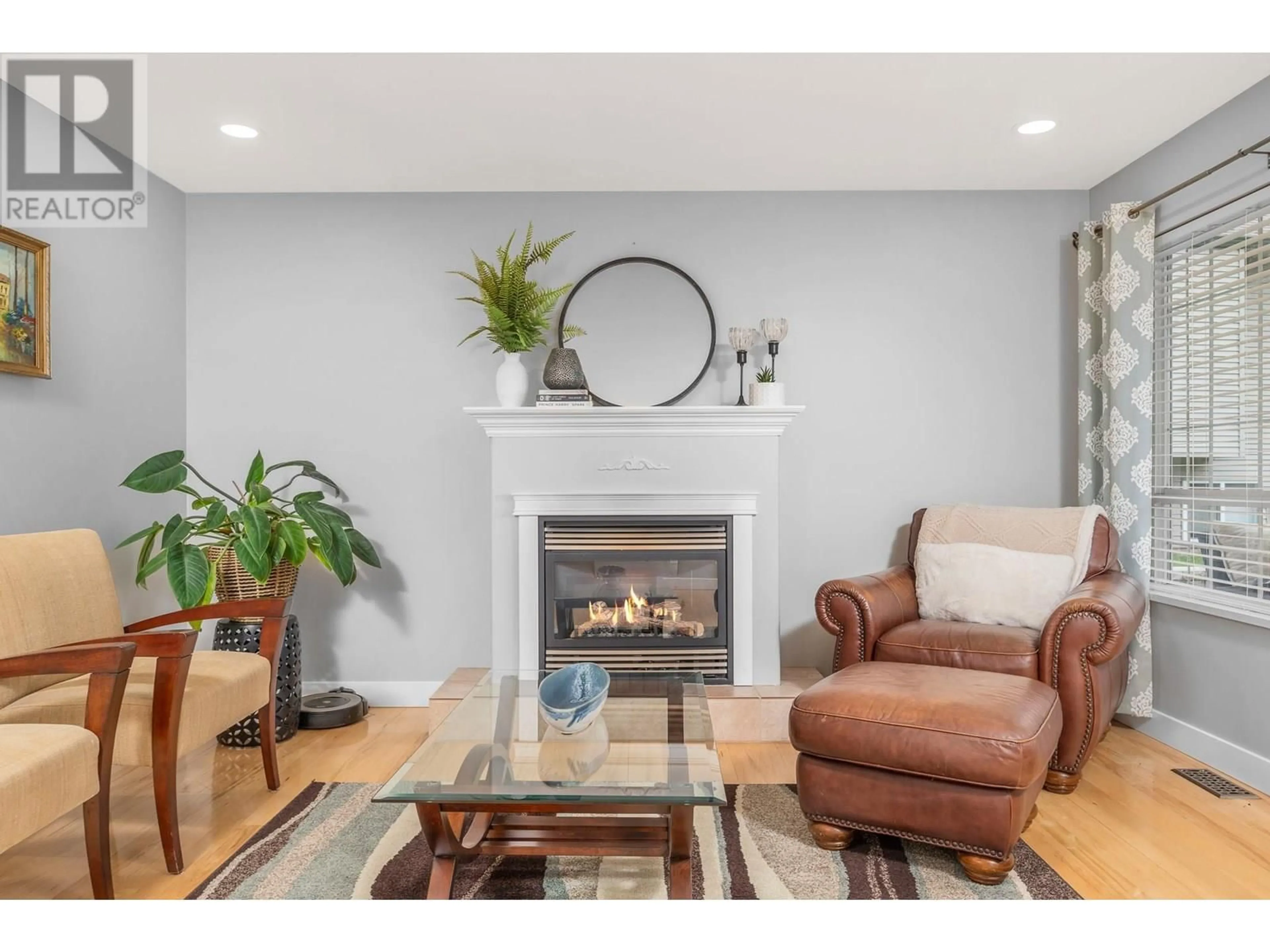 Living room with furniture, wood/laminate floor for 241 INVERNESS DRIVE, Coldstream British Columbia V1B3V9