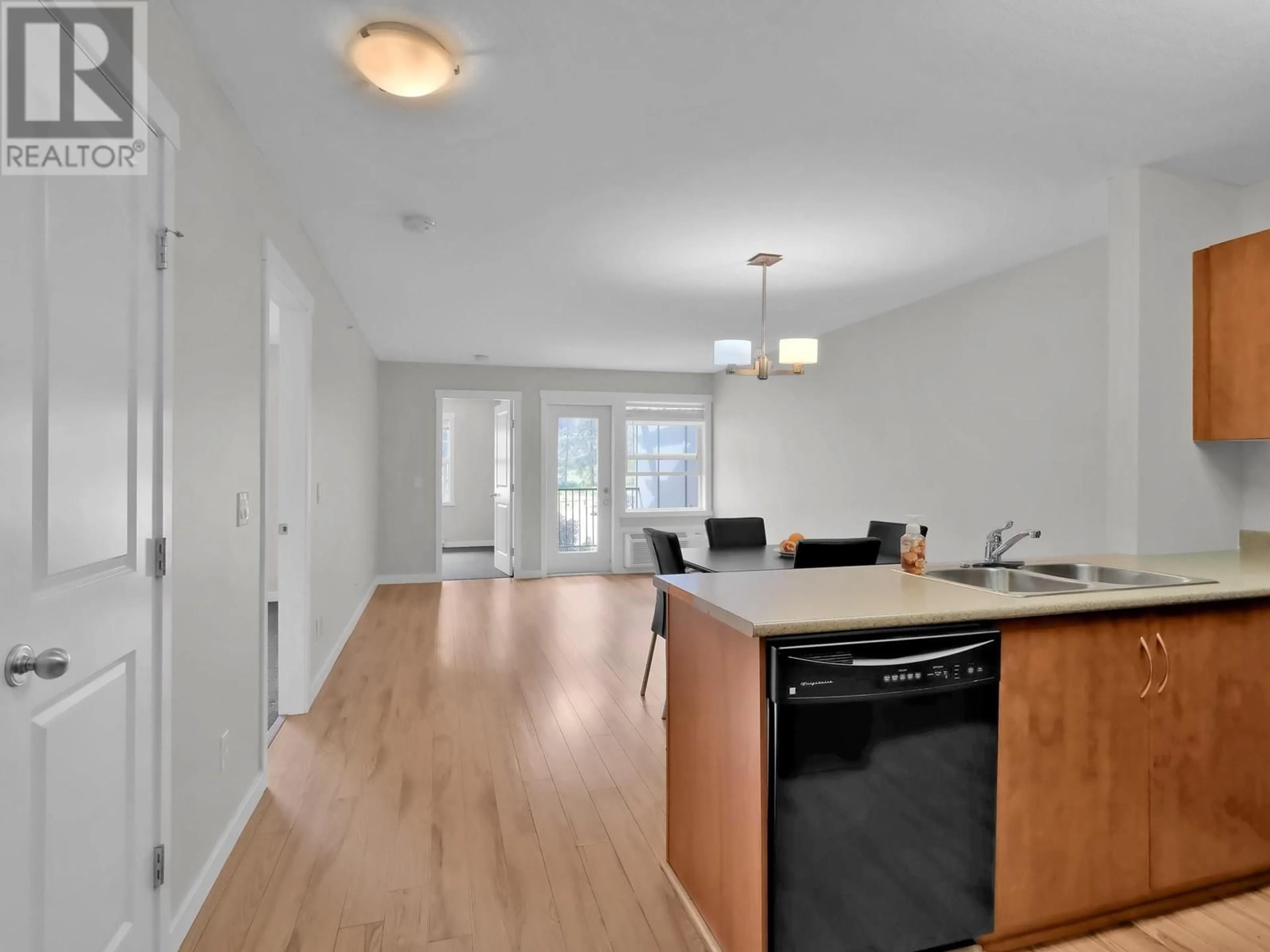 Open concept kitchen, wood/laminate floor for 302 - 1479 GLENMORE ROAD NORTH, Kelowna British Columbia V1V2C5