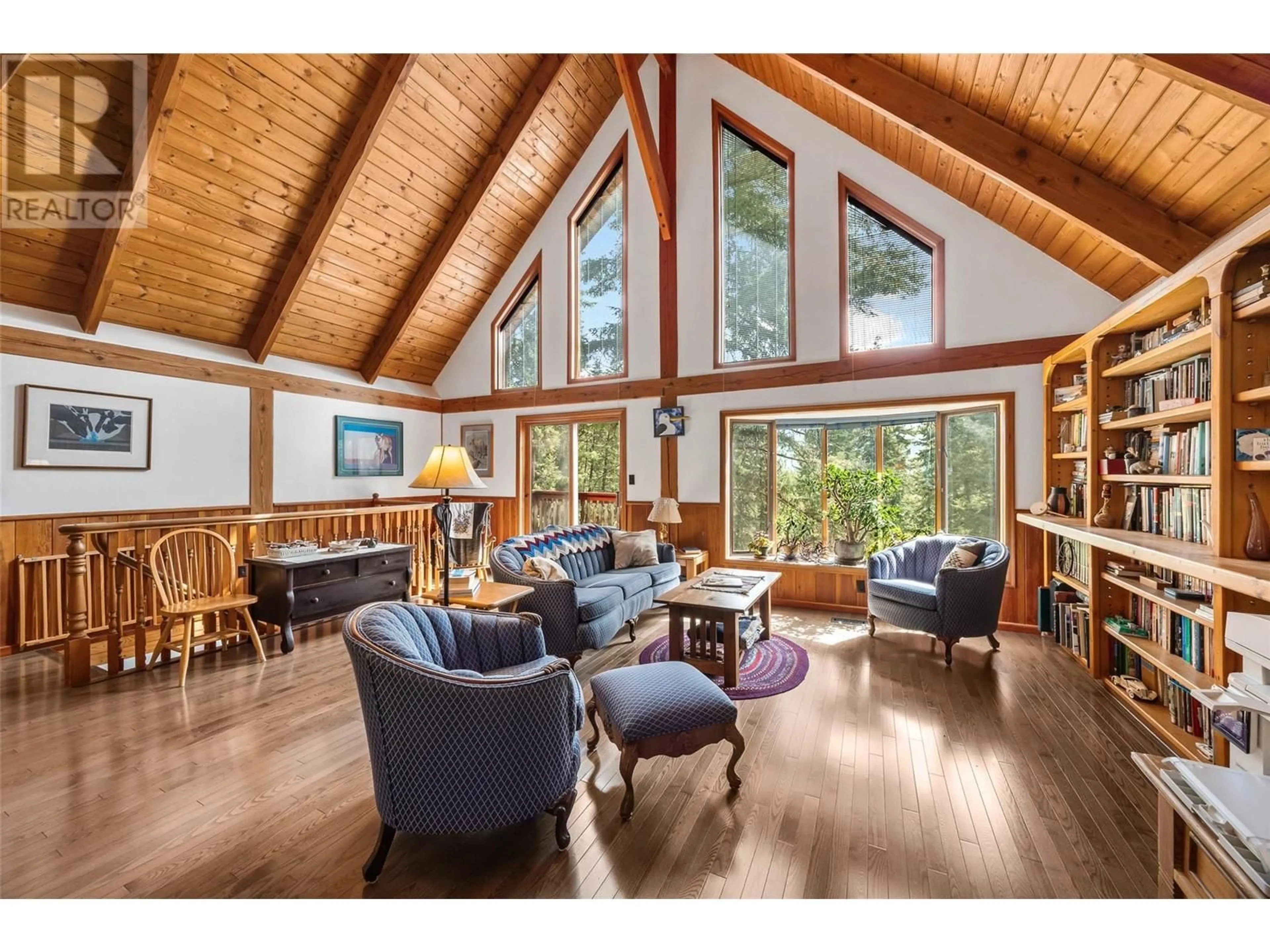 Living room with furniture, wood/laminate floor for 2383 HEFFLEY LOUIS CREEK ROAD, Kamloops British Columbia V0E1Z1
