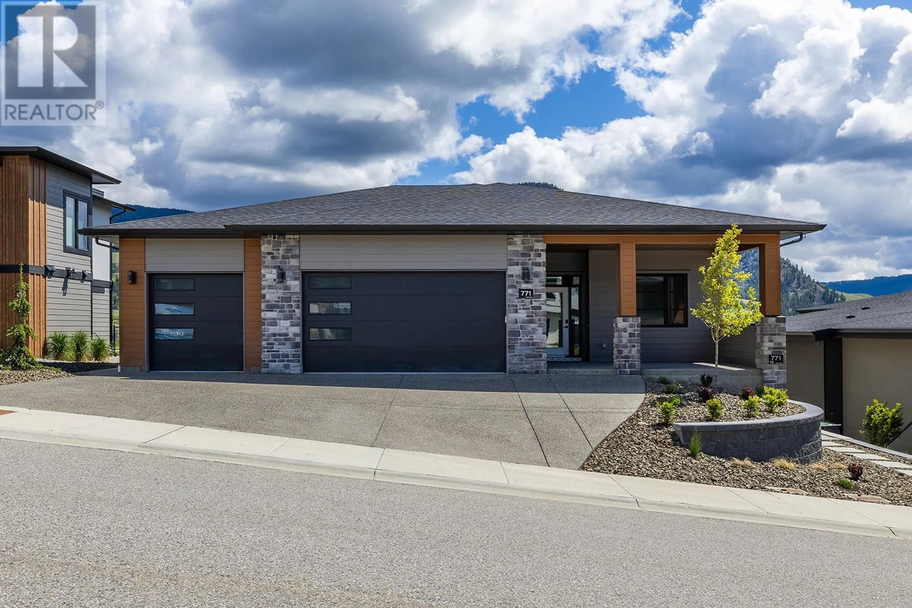 Home with brick exterior material, street for 771 CARNOUSTIE DRIVE, Kelowna British Columbia V1P0A3
