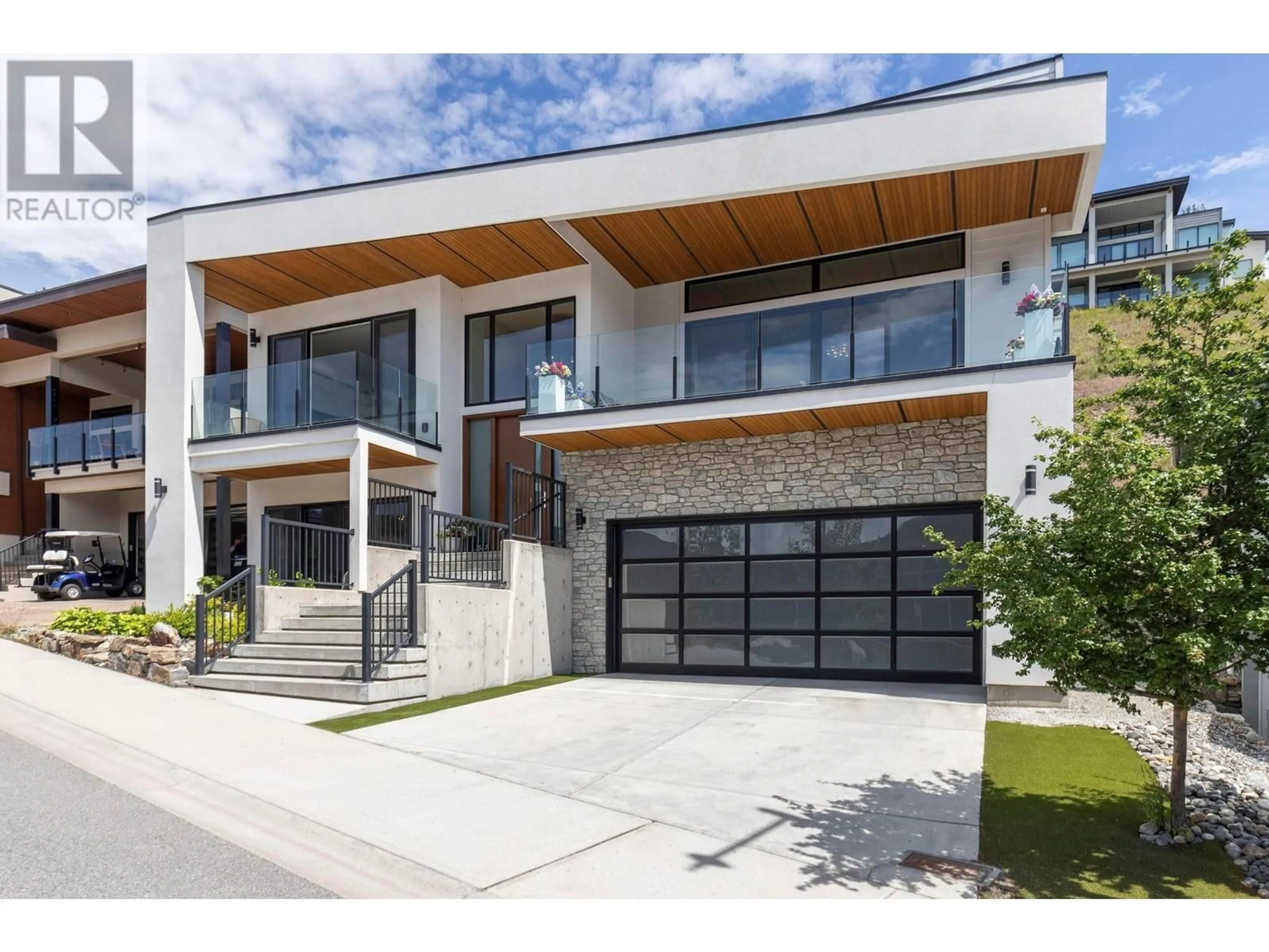 Home with brick exterior material, street for 3567 MCKINLEY BEACH DRIVE, Kelowna British Columbia V1V3G2