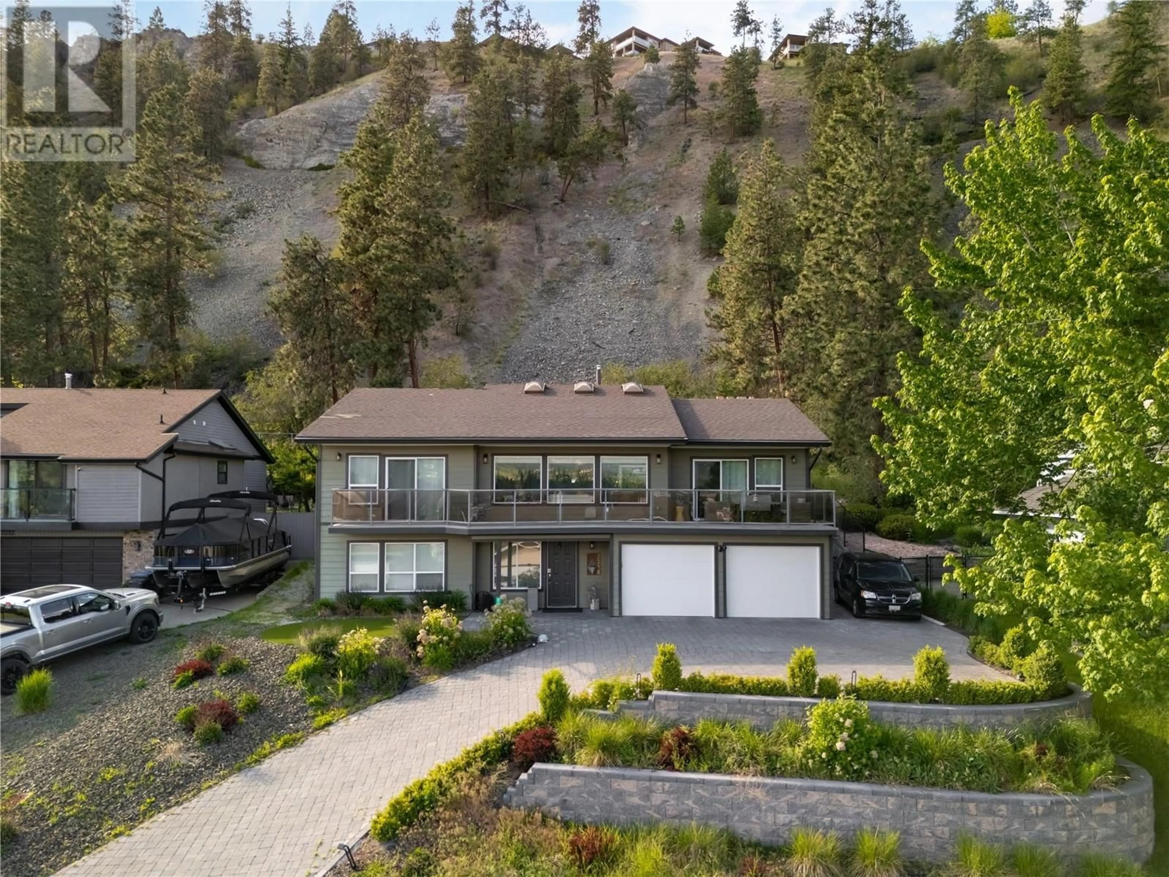 A pic from outside/outdoor area/front of a property/back of a property/a pic from drone, mountain view for 2218 OMINECA PLACE, Kelowna British Columbia V1V1H7