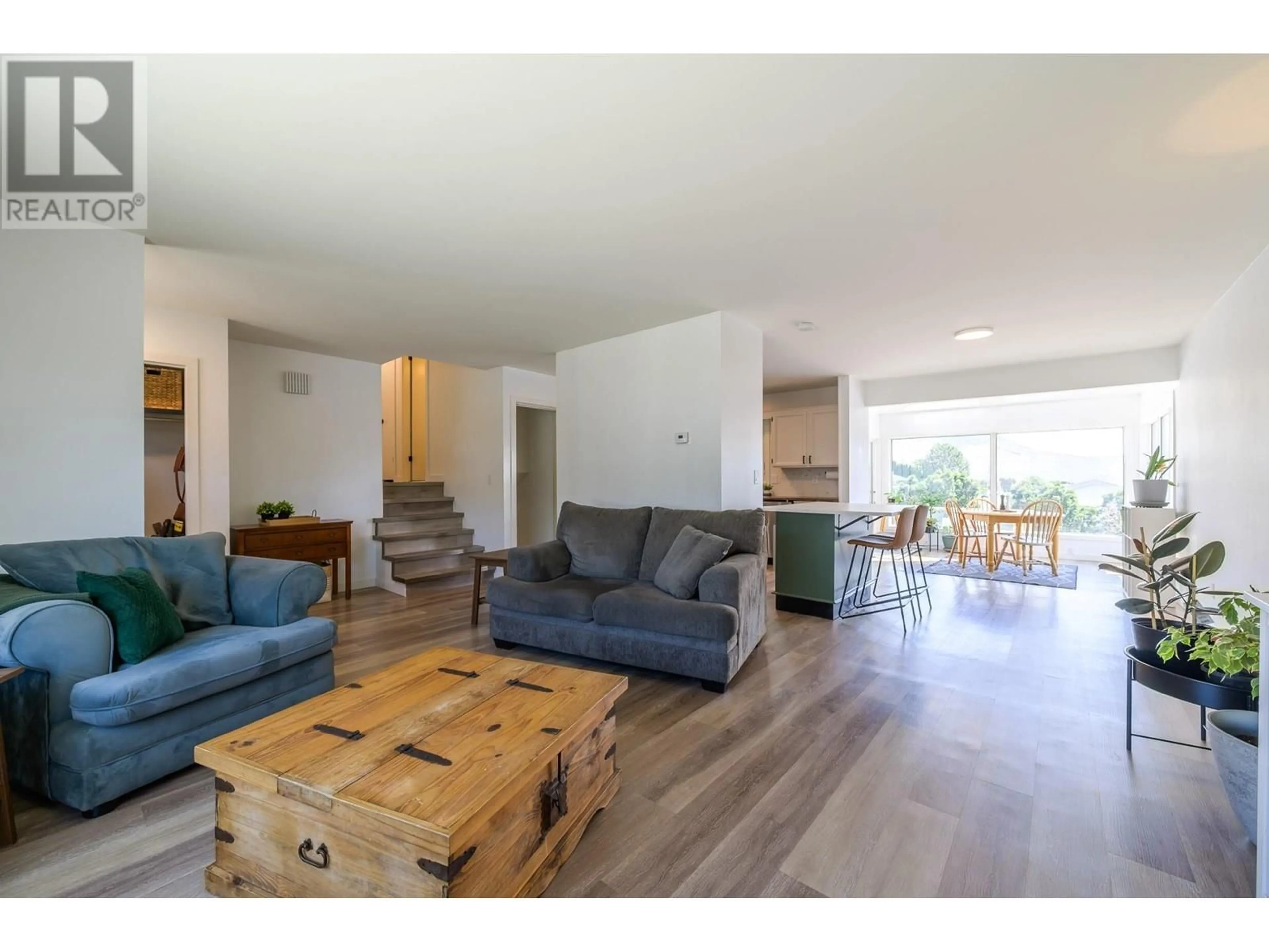 Living room with furniture, wood/laminate floor for 1737 PENNASK TERRACE, Kamloops British Columbia V2B7N9