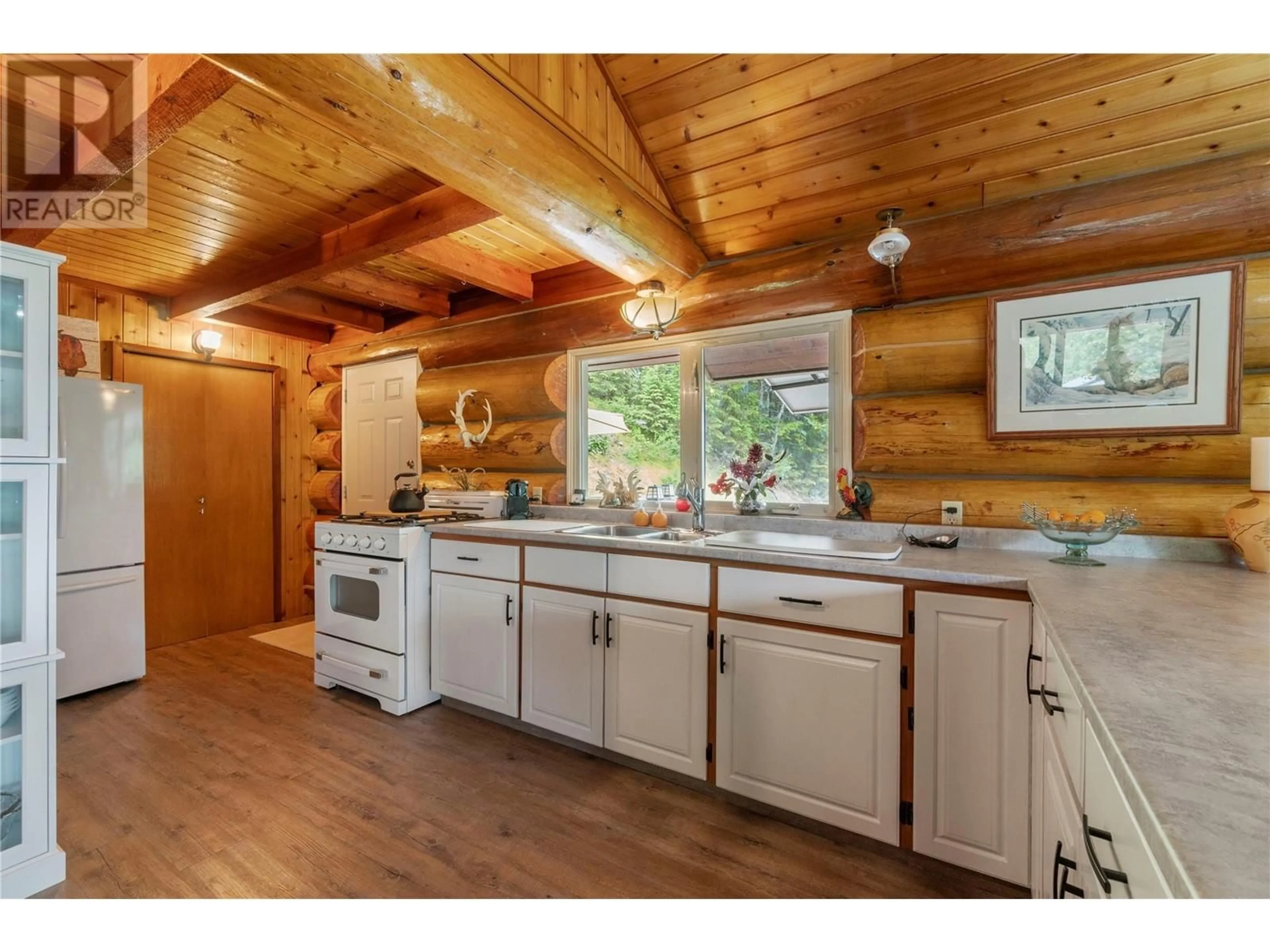 Open concept kitchen, wood/laminate floor for 1372 SEYMOUR RIVER ROAD, Seymour Arm British Columbia V0E2V2
